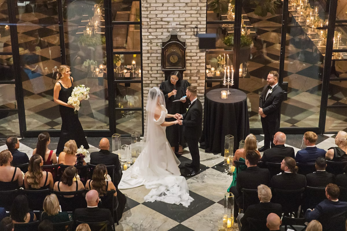 Bride and Groom Wedding Ceremony Vow Exchange Wedding Portrait | Modern Timeless Indoor Wedding Ceremony on Checkered Floor with Minimalistic Design Details | Intimate Timeless Black and White Wedding Ceremony Inspiration | South Tampa Venue Oxford Exchange | Tampa Bay Photographer Limelight Photography