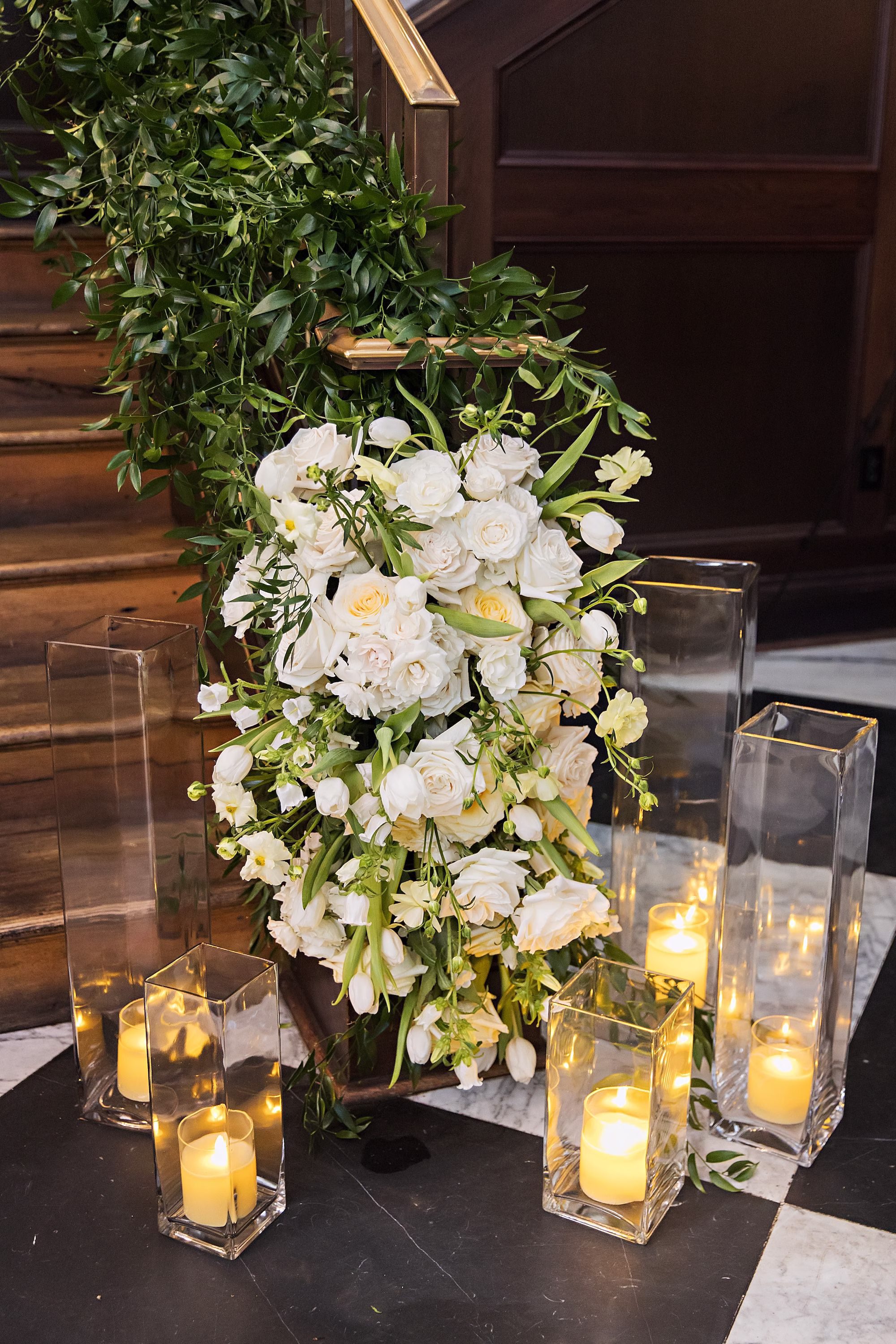 Elegant Black and White Wedding Reception Ceremony Decor Inspiration | Green Ivy Staircase Garland Decor Ideas | White Roses with Romantic Candlelight Decor Inspiration