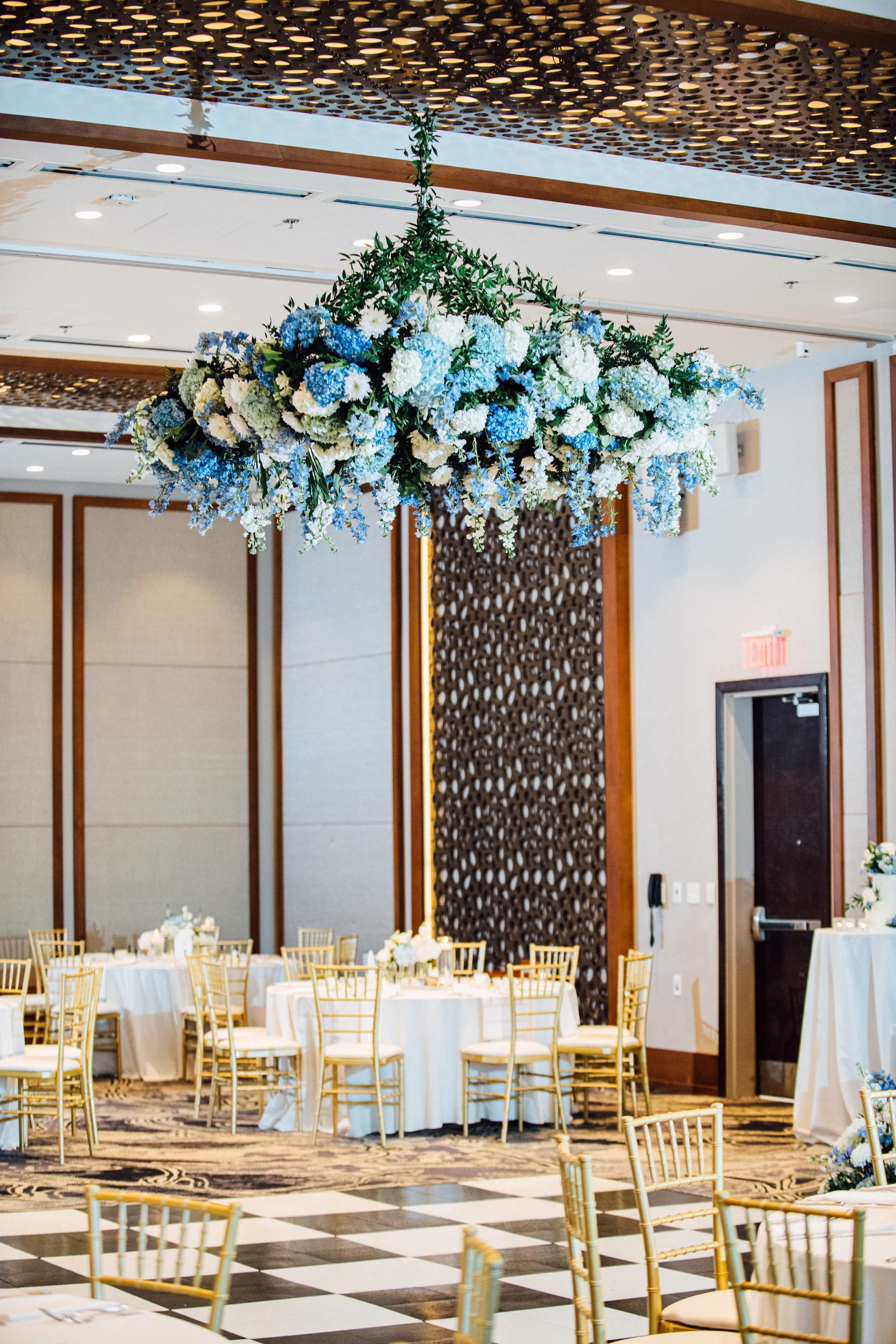 31Elegant Blue Coastal Waterfront Florida Wedding Ideas The CURRENT - Elegant Blue and White Tampa Wedding | The CURRENT Elegant Blue Coastal Waterfront Florida Wedding Reception Floral Chandelier Decor Ideas