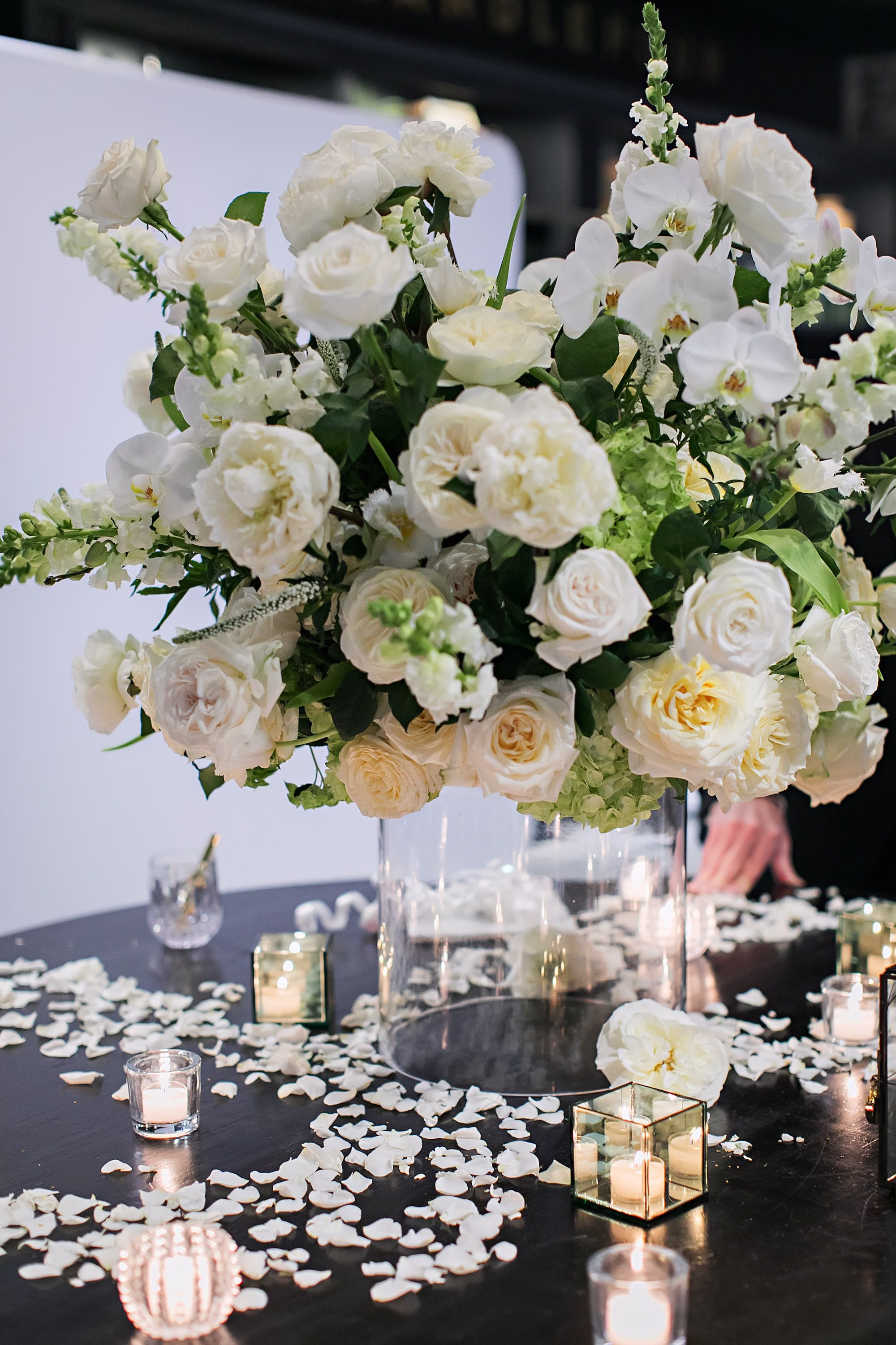 Timeless Monochromatic White Wedding Wedding Reception Table Decor Centerpiece Inspiration | White Roses, Peonies, Orchids Glass Vase Ideas | Romantic Tea Light Candles Decor Inspiration