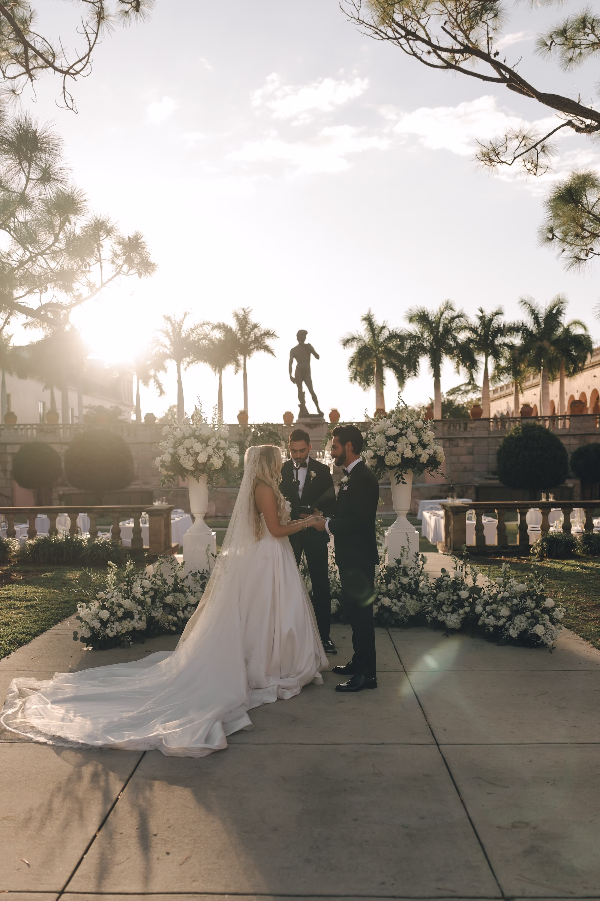 Luxurious White and Greenery Outdoor Florida Courtyard Wedding Ceremony Decor Inspiration | Sarasota Event Venue The Ringing Museum of Art | Photographer Amber Yonker Photography