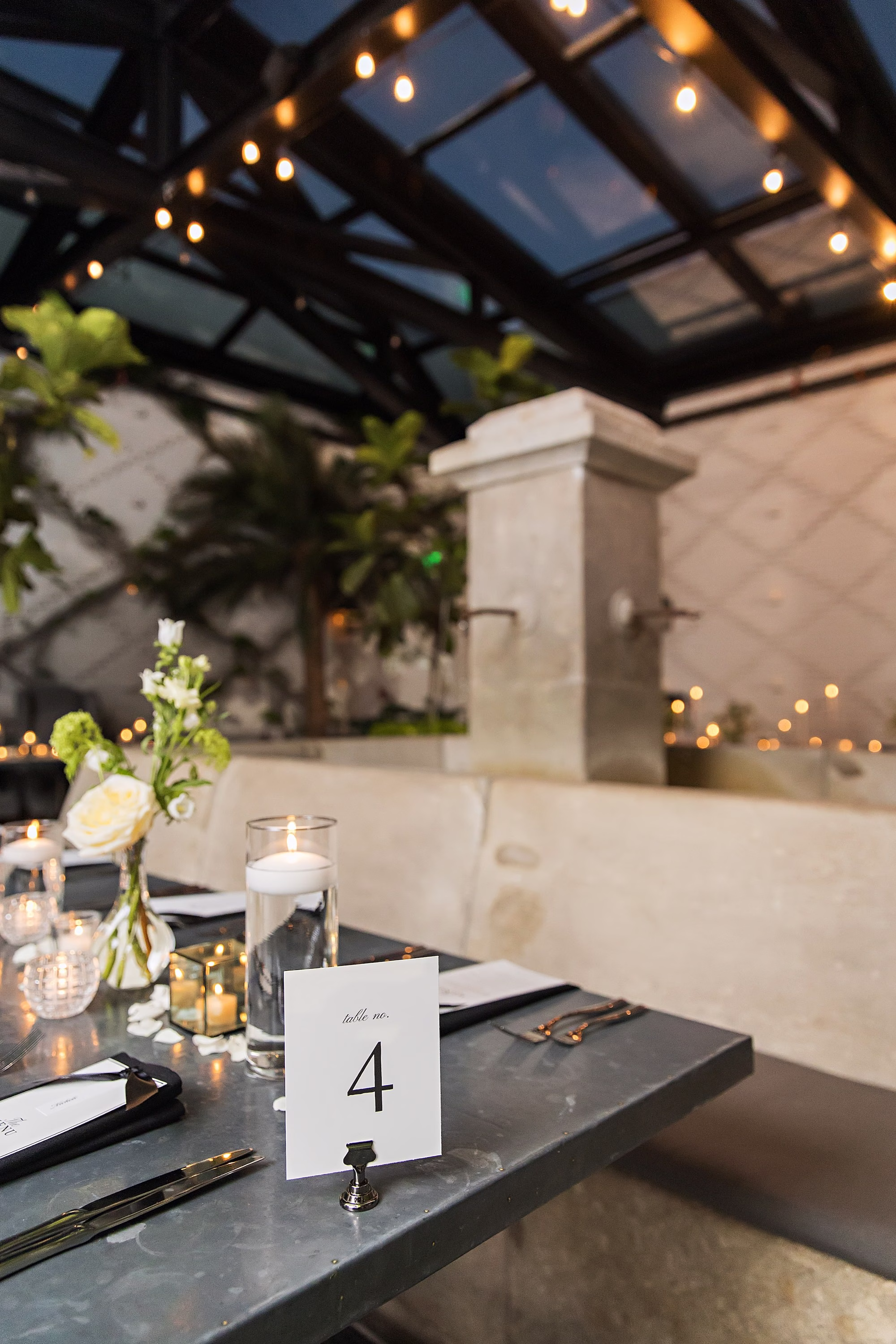 Timeless Black and White Wedding Reception Table Number Card Decor Inspiration | Single Stem White Rose with White Florals in Bud Vase Centerpiece Decor Ideas