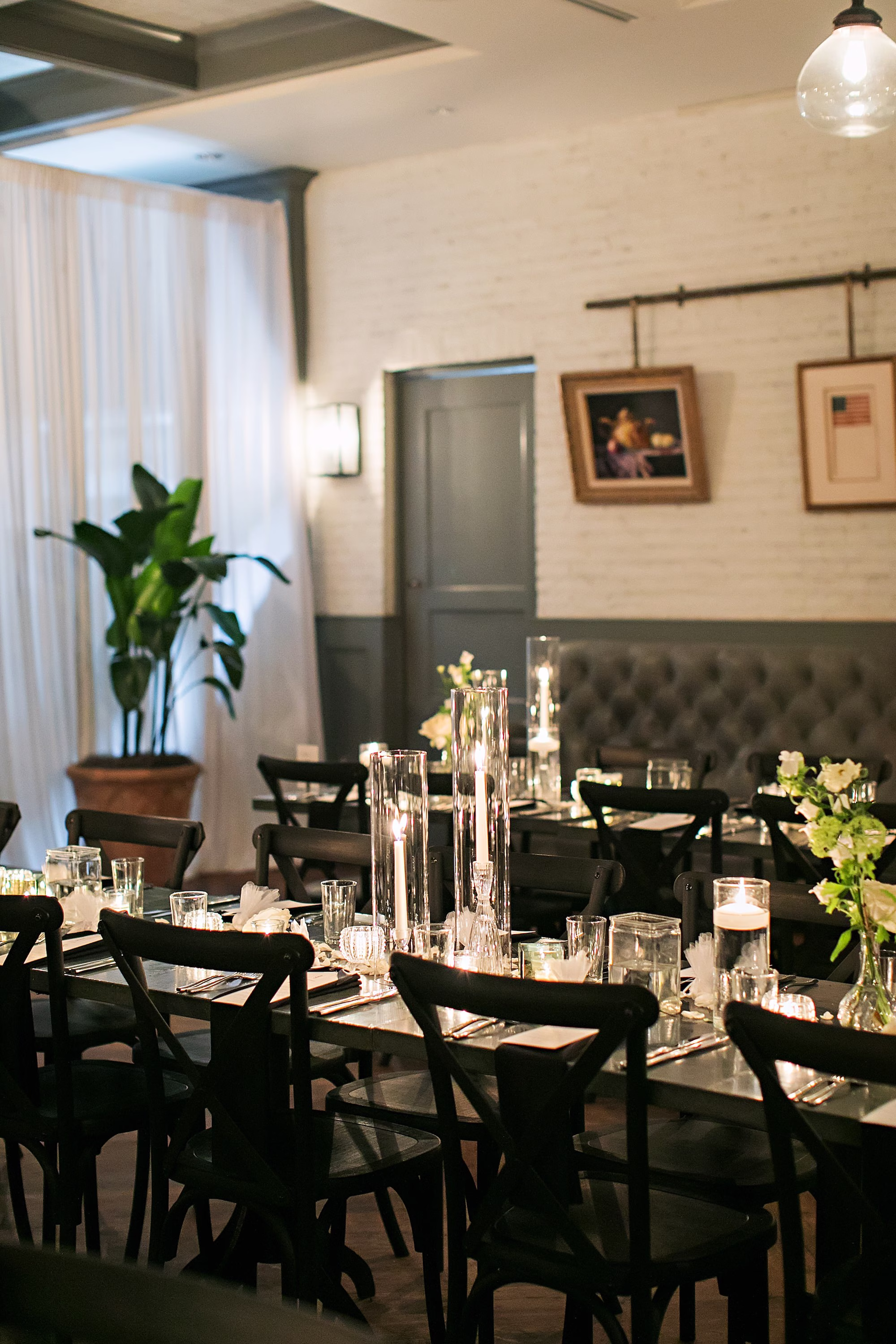 Classic Romantic Black and White Conservatory Wedding Reception Inspiration | Romantic Floating Candles and Monochromatic White Rose Centerpiece Decor Ideas | Tampa Event Venue Oxford Exchange