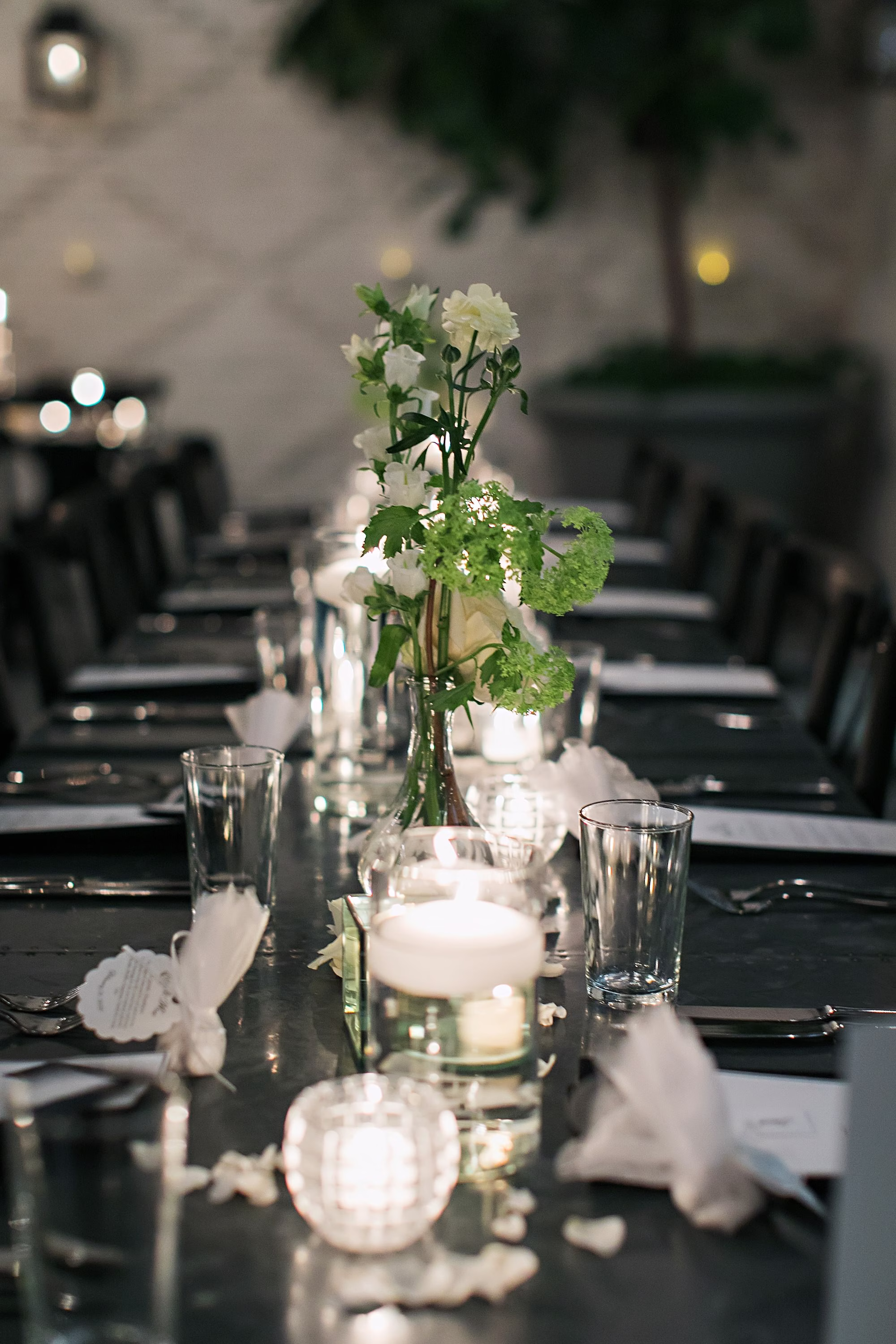 Classic Romantic Black and White Conservatory Wedding Reception Inspiration | Romantic Floating Candles and Monochromatic White Rose Centerpiece Decor Ideas | Tampa Event Venue Oxford Exchange