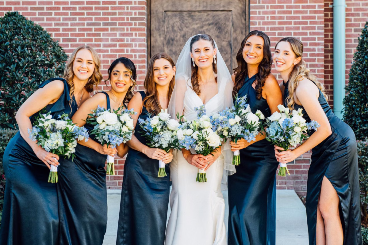 4Elegant Blue Coastal Waterfront Florida Wedding Ideas - Elegant Blue and White Tampa Wedding | The CURRENT Bride and Bridesmaids Wedding Portrait | Navy Satin Mismatched Bridesmaids Dress Ideas