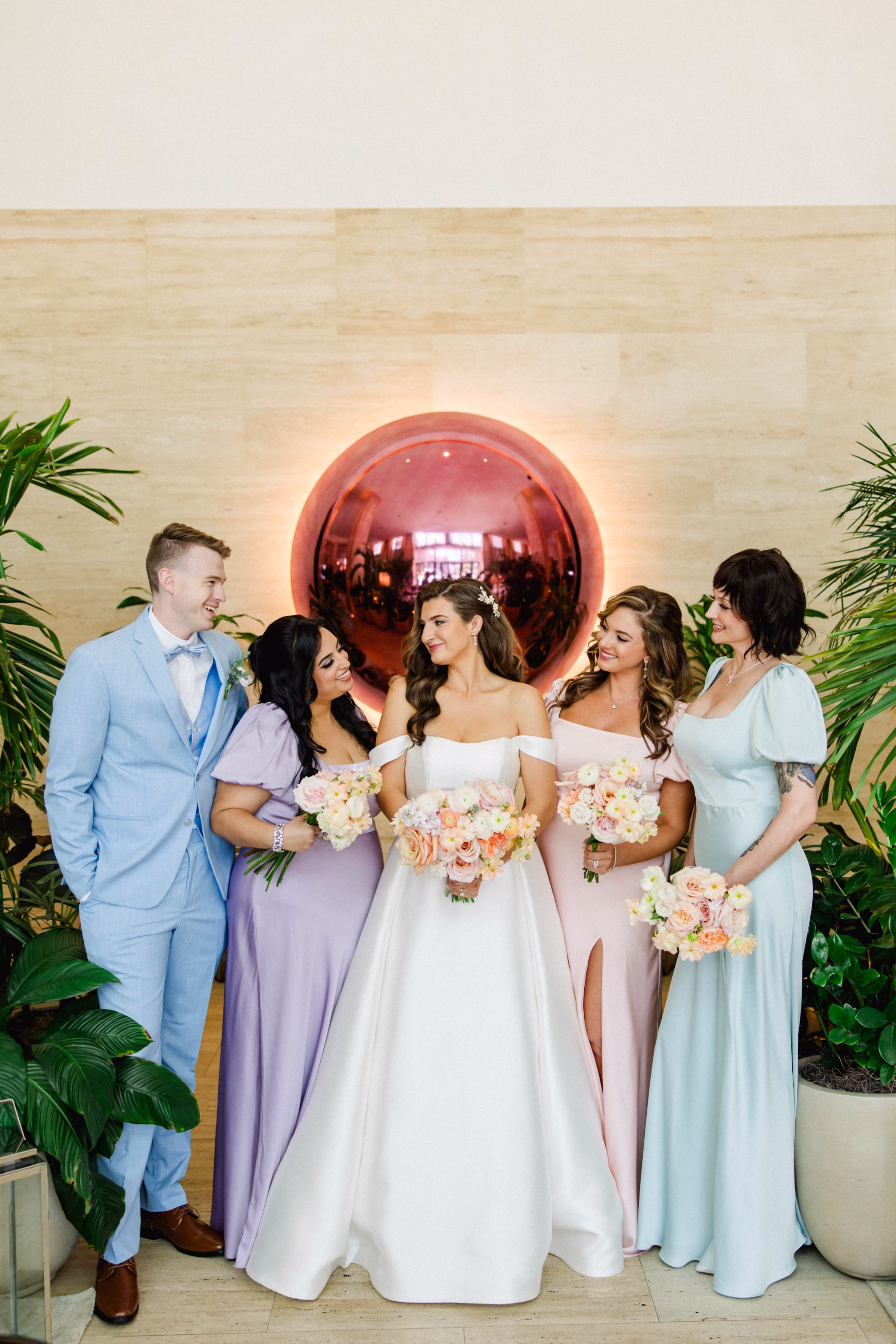 Bride with Bridesmaids Wedding Portrait | Pastel Blue, Lavender, Pink Bridesmaid Dresses Inspiration | Light Blue Bridesman Suit Ideas | Spring Garden Pastel Bridal Bouquet Inspiration
