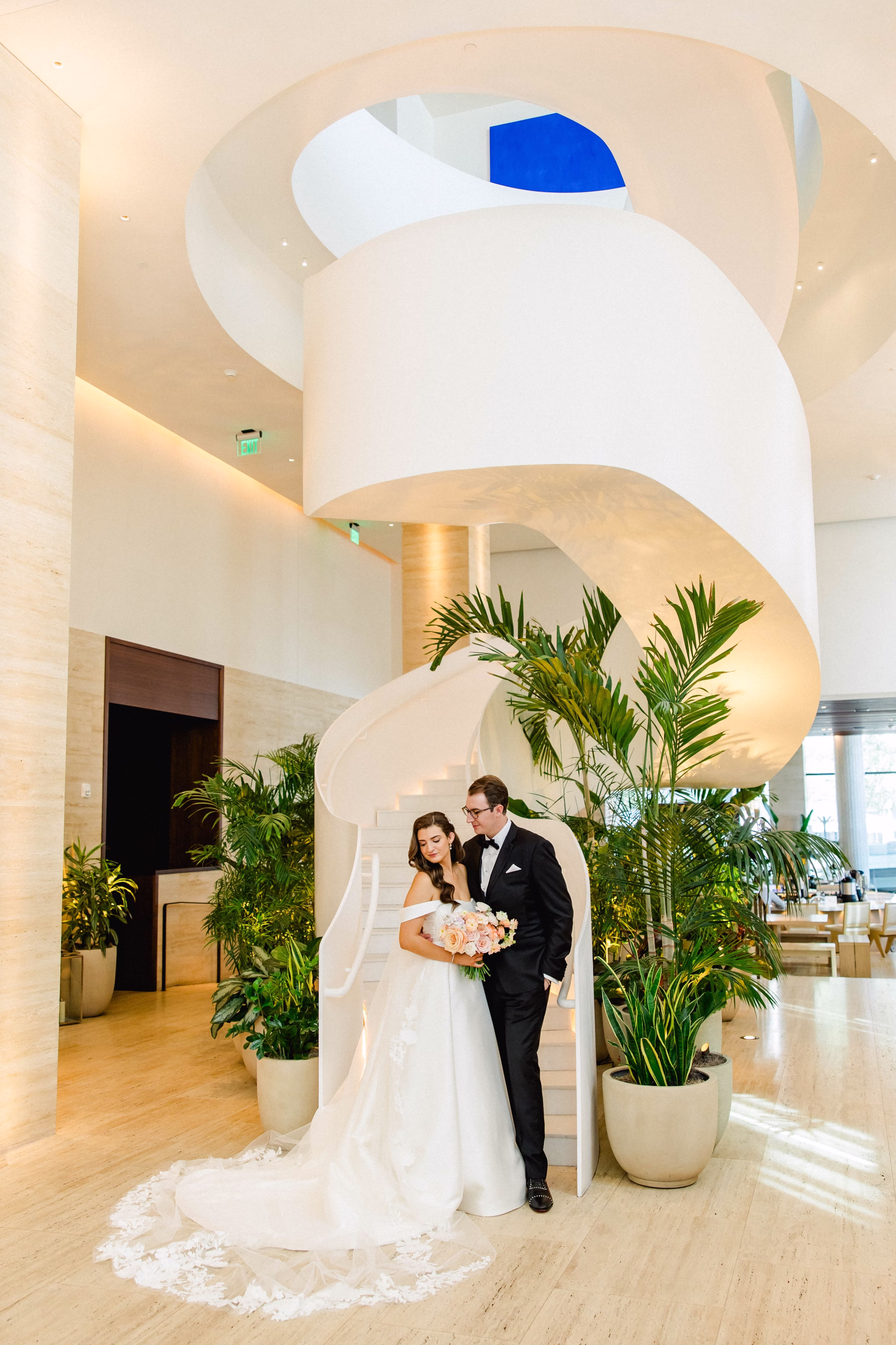 Bride and Groom Wedding Portrait in Front of Spiral Staircase in Downtown Event Venue The Edition Hotel Tampa