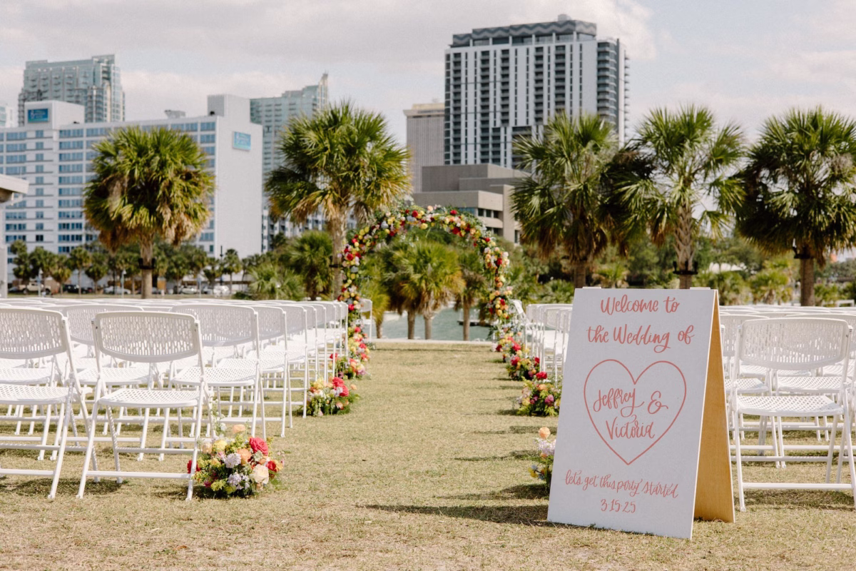 19Whimsical Pastel Spring Orange Yellow and Purple Wedding Inspiration Venue Tampa River Center - Whimsical, Colorful Waterfront Wedding | Tampa River Center Riverfront Wedding Ceremony with White Garden Chairs Inspiration | White and Pink Welcome Wedding Sign Ideas | Tampa Bay Planner Wilder Mind Events | Florida Sign Designer madWOLFE