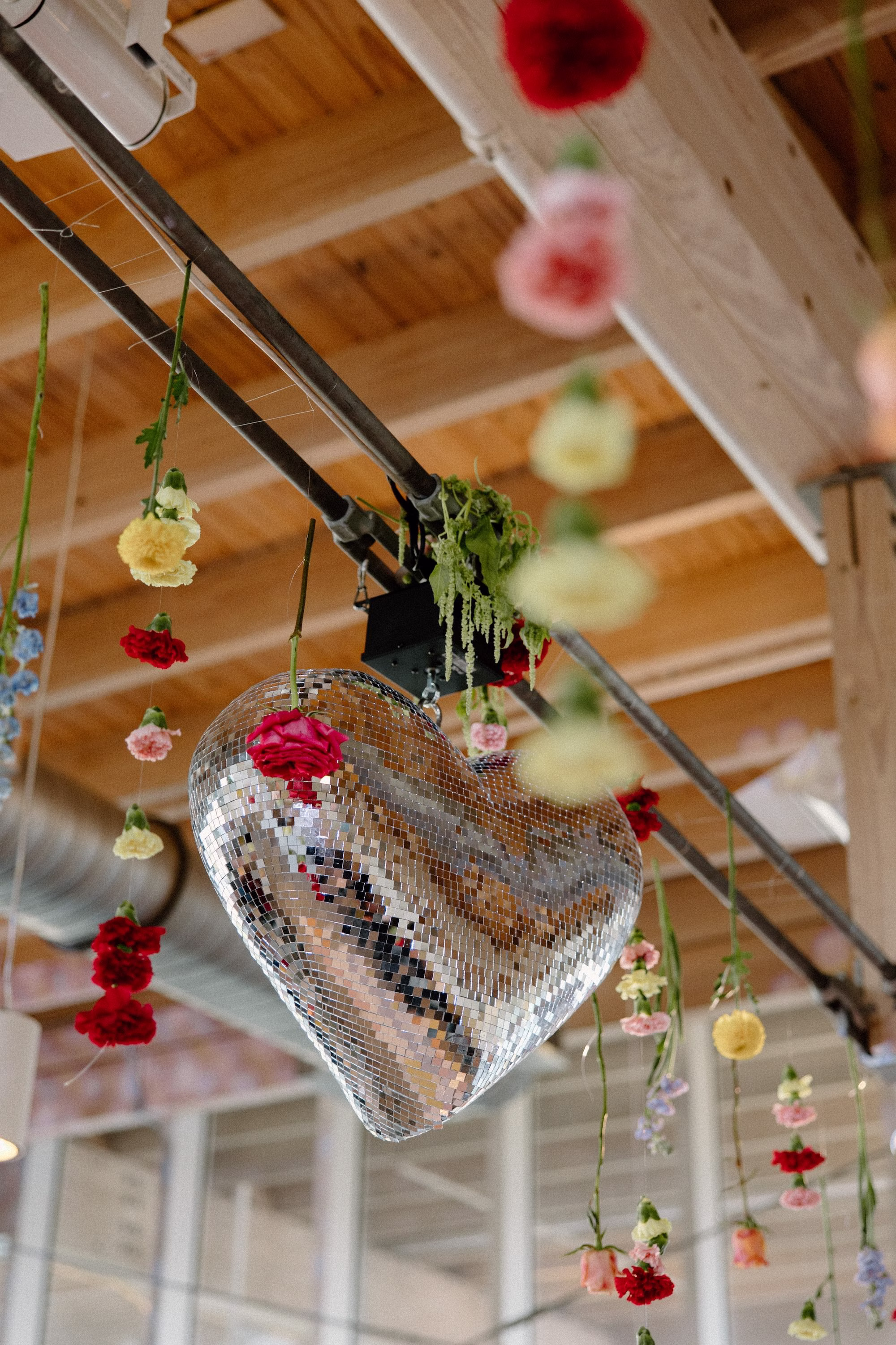 43Whimsical Pastel Spring Orange Yellow and Purple Wedding Inspiration - Whimsical, Colorful Waterfront Wedding | Tampa River Center Heart Wedding Reception Dance Floor Disco Ball Decor Ideas | Single Stem Spring Red, Pink, Yellow Florals Hanging Ceiling Decor Inspiration | Tampa Bay Planner Wilder Mind Events