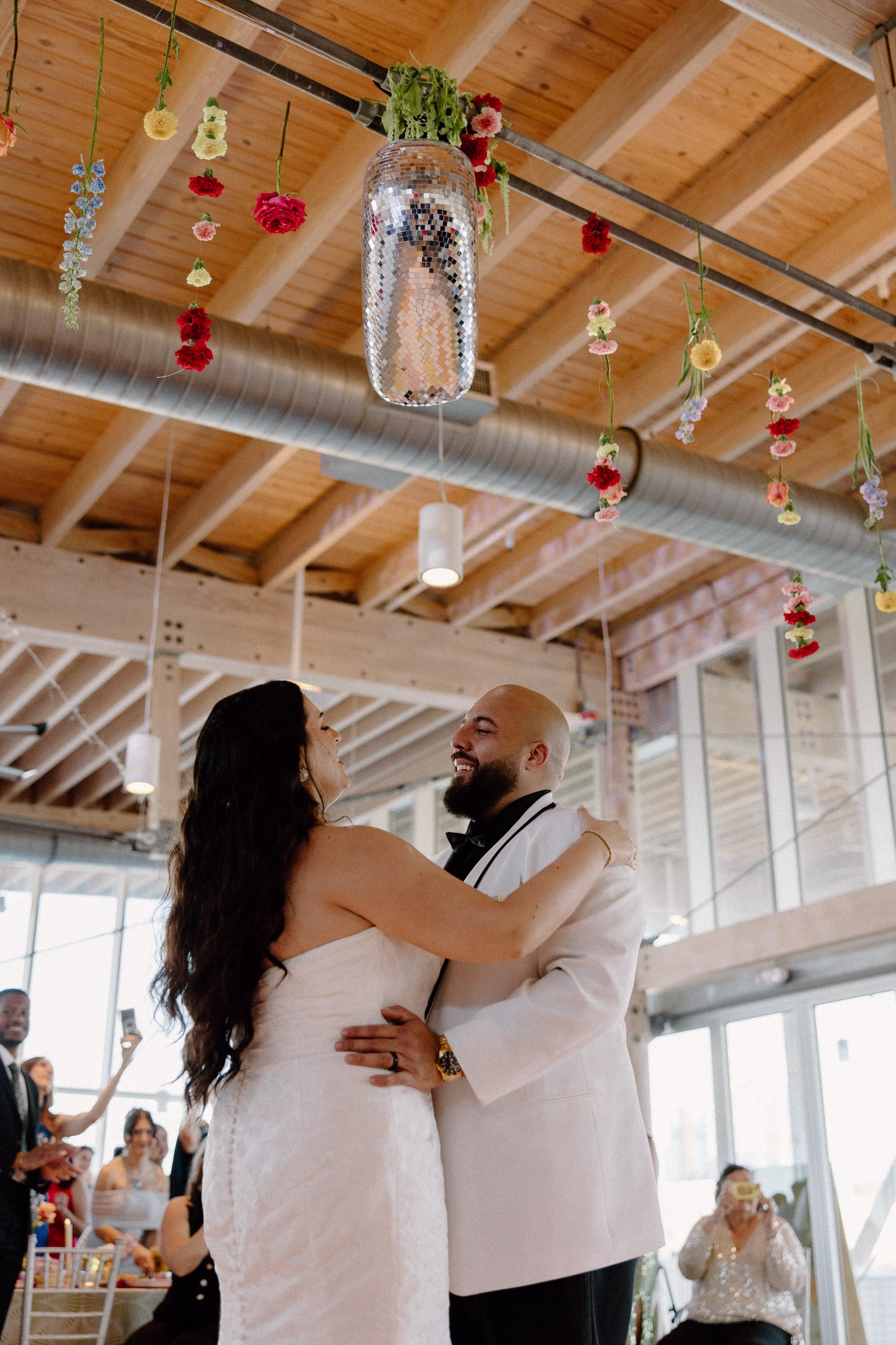 51Whimsical Pastel Spring Orange Yellow and Purple Wedding Inspiration Venue Tampa River Center - Whimsical, Colorful Waterfront Wedding | Tampa River Center Bride and Groom First Dance Wedding Portrait | Heart Wedding Reception Dance Floor Disco Ball Decor Ideas | Single Stem Spring Red, Pink, Yellow Florals Hanging Ceiling Decor Inspiration | Tampa Bay Planner Wilder Mind Events | Tampa Bay DJ Tampa Bay DJ Co