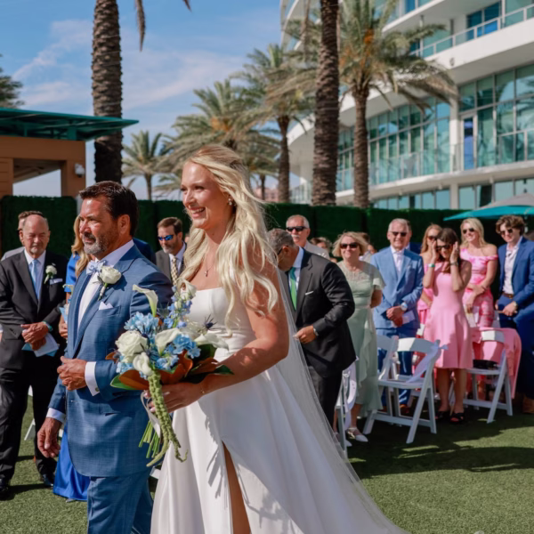 15Elegant Light Blue Coastal Florida Wedding Ideas - Elegant Blue Modern Coastal Wedding | Opal Sands Clearwater Beach Bride and Father Walking Down Rooftop Wedding Ceremony Aisle with Blue and White Bouquet