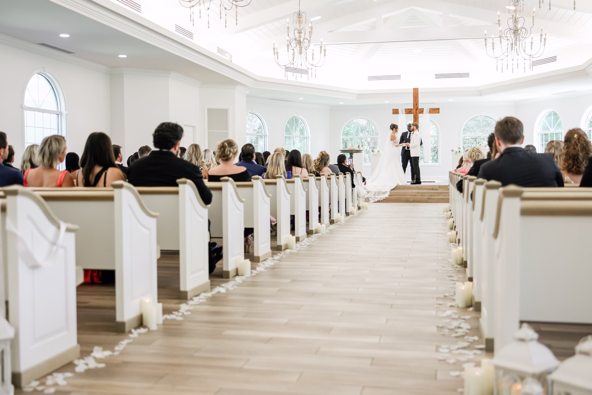 Bride and Groom Wedding Ceremony Vow Exchange Wedding Portrait | Traditional Church Wedding Ceremony Decor Ideas | Ceremony Venue Harborside Chapel | Clearwater Photographer Lifelong Photography Studio | Content Creator Behind The Vows