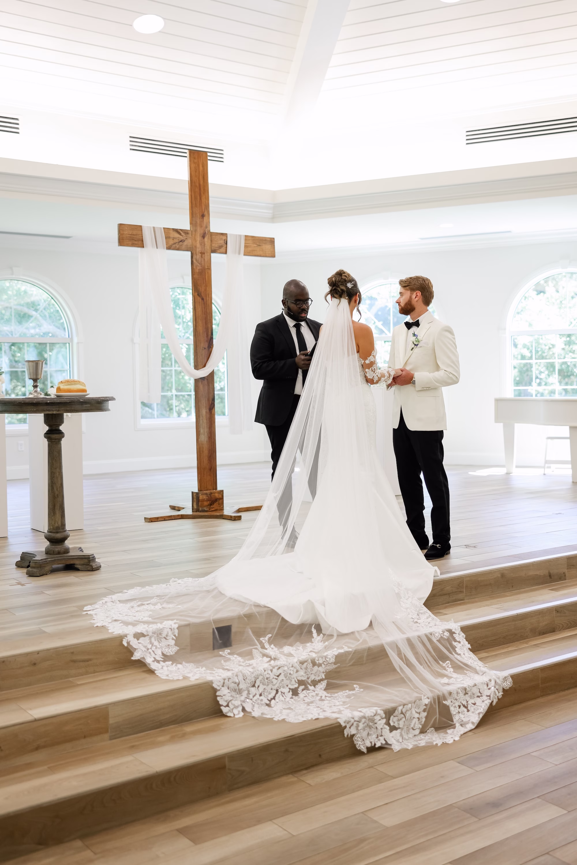 Bride and Groom Wedding Ceremony Vow Exchange Wedding Portrait | Traditional Church Wedding Ceremony Decor Ideas | Ceremony Venue Harborside Chapel | Clearwater Photographer Lifelong Photography Studio | Content Creator Behind The Vows