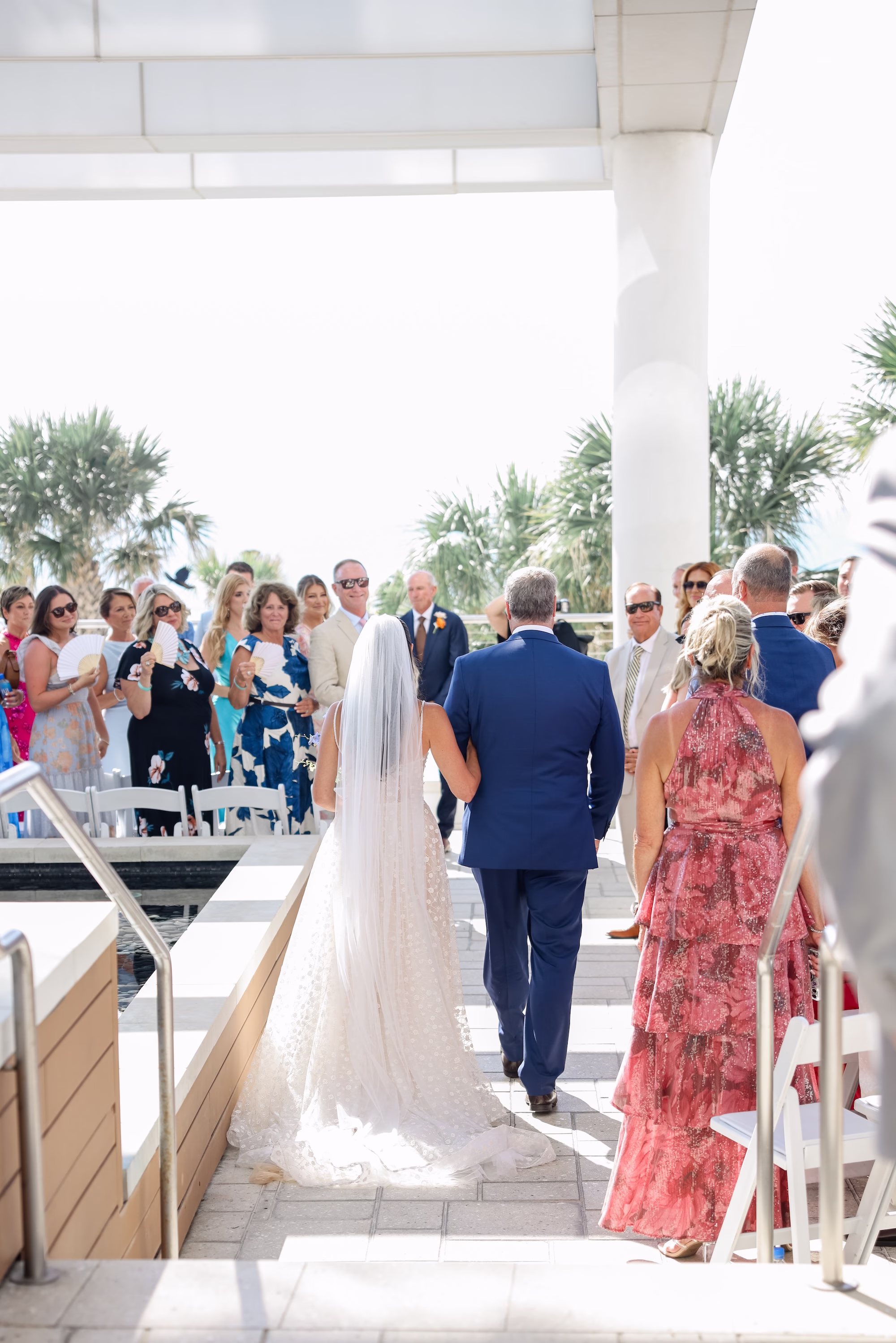 22Tropical Pastel Florida Wedding Inspiration - Tropical, Pastel Outdoor Wedding | Opal Sands Clearwater Beach Bride and Father Walking Down Wedding Aisle