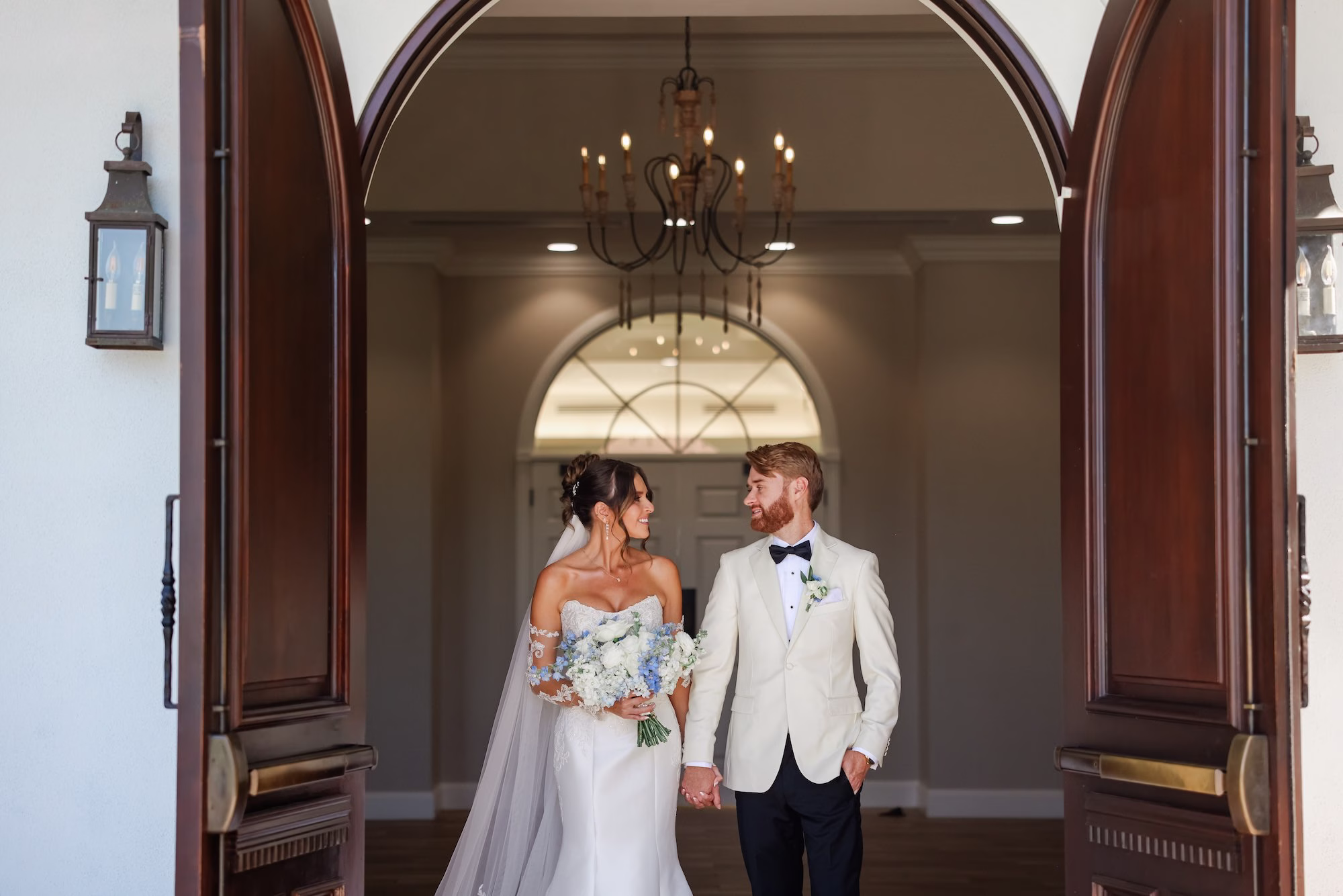 Bride and Groom Wedding Ceremony Just Married Wedding Portrait | Elegant Strapless The Dessy Group White Wedding Gown with Lace Bodice and Sleeves Ideas | Soft Curled Bun Bridal Hair with Traditional Veil Inspiration | Clearwater Photographer Lifelong Photography Studio | Tampa Boutique Truly Forever Bridal | Ybor Hair and Makeup Artist Adore Bridal Hair and Makeup | Content Creator Behind The Vows