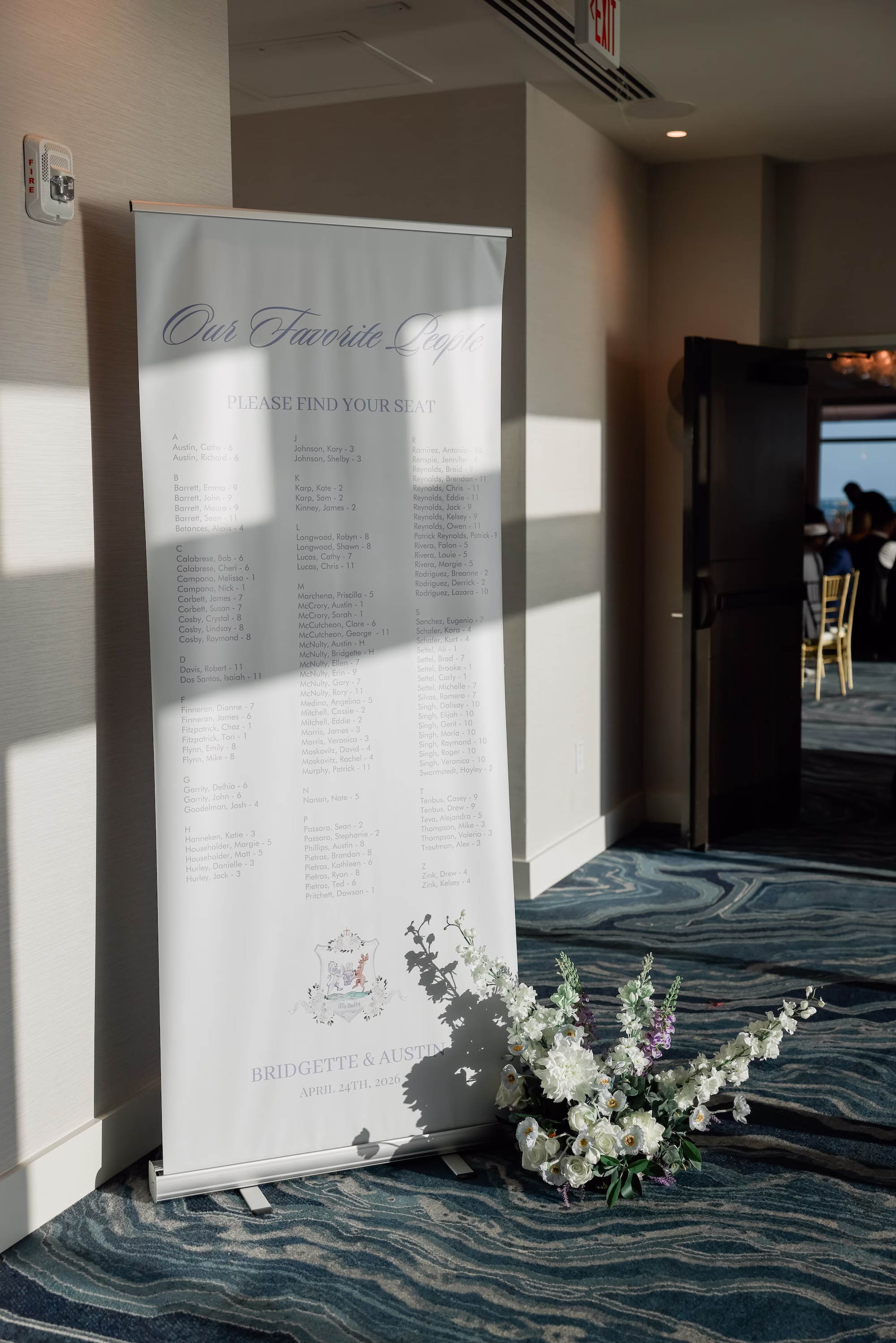 Modern White Fabric Banner Seating Chart Wedding Reception Decor Inspiration | White, Blue and Purple Floral Arrangement Wedding Reception Decor Ideas