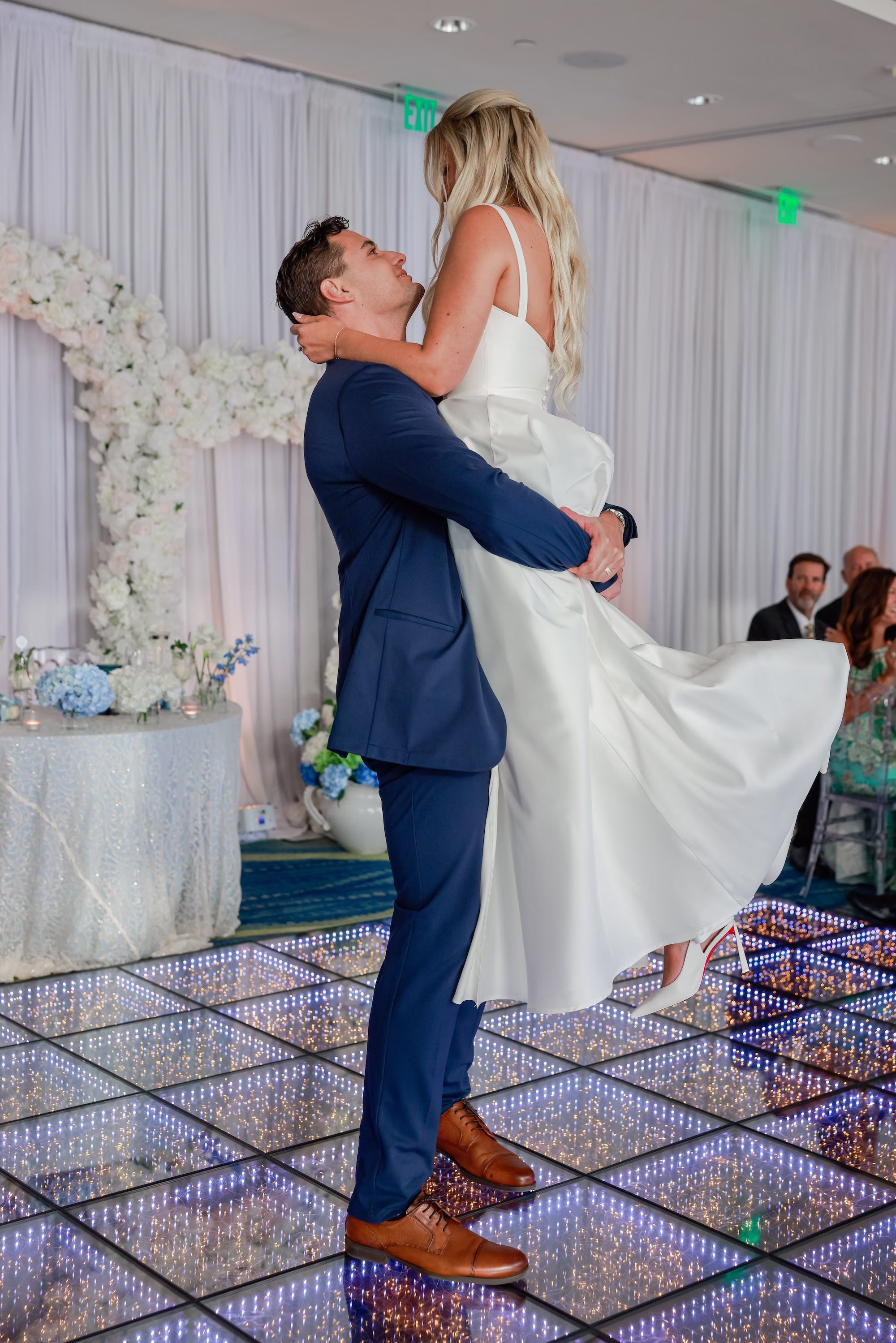 47Elegant Light Blue Coastal Florida Wedding Ideas - Elegant Blue Modern Coastal Wedding | Opal Sands Clearwater Beach Groom Lifting Bride on LED Infinity Dance Floor Wedding Reception Portrait | Clearwater Beach DJ Grant Hemond & Associates