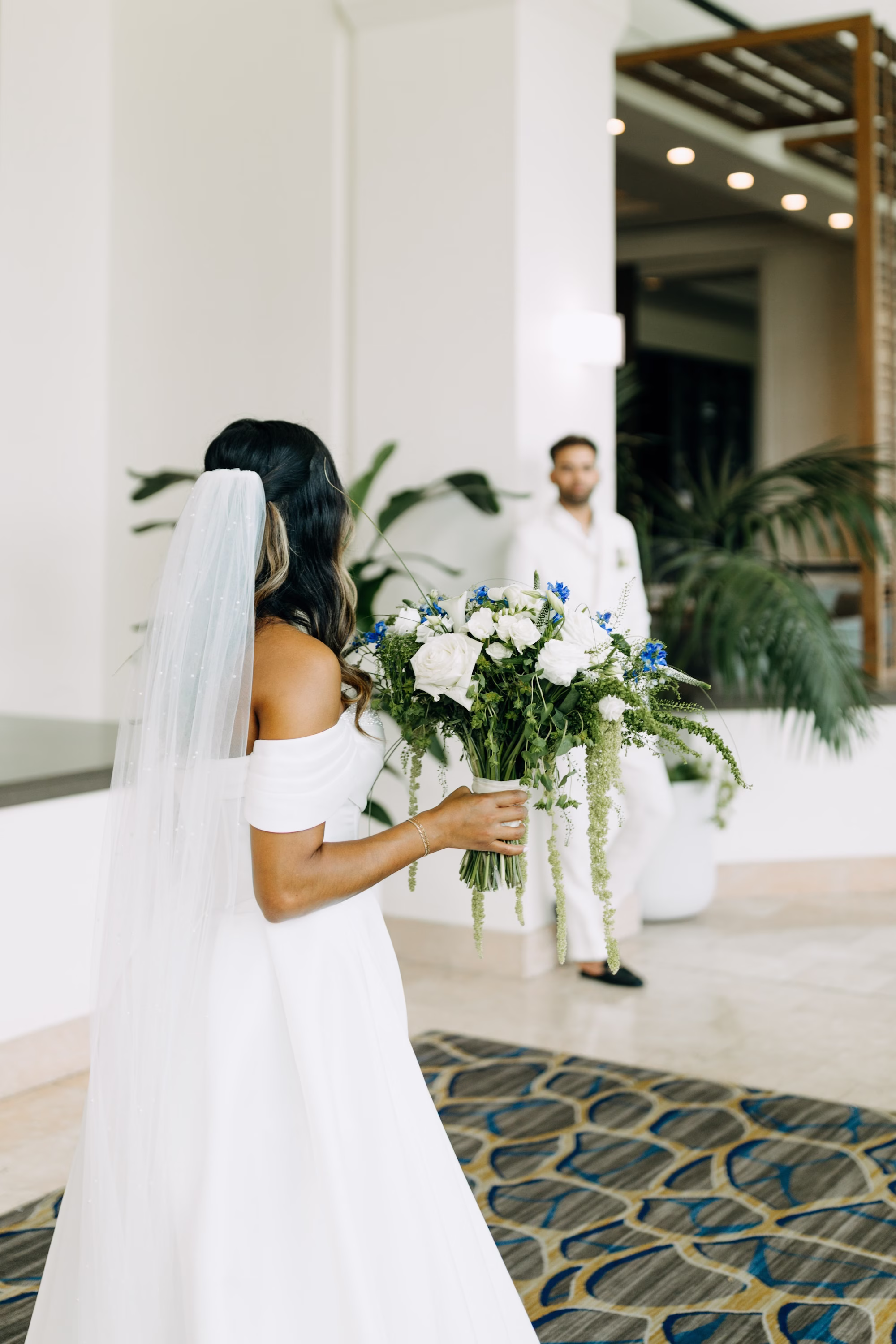 7Modern Blue Coastal Wedding Inspiration - Coastal Dusty Blue Waterfront Wedding Inspiration | Grand Hyatt Tampa Bay Bride and Groom First Look Wedding Portrait | White and Blue Bridal Wedding Bouquet | Tampa Florist La Maison des Fleurs | Photographer Amber McWhorter Photography | Videographer Cinemamouré