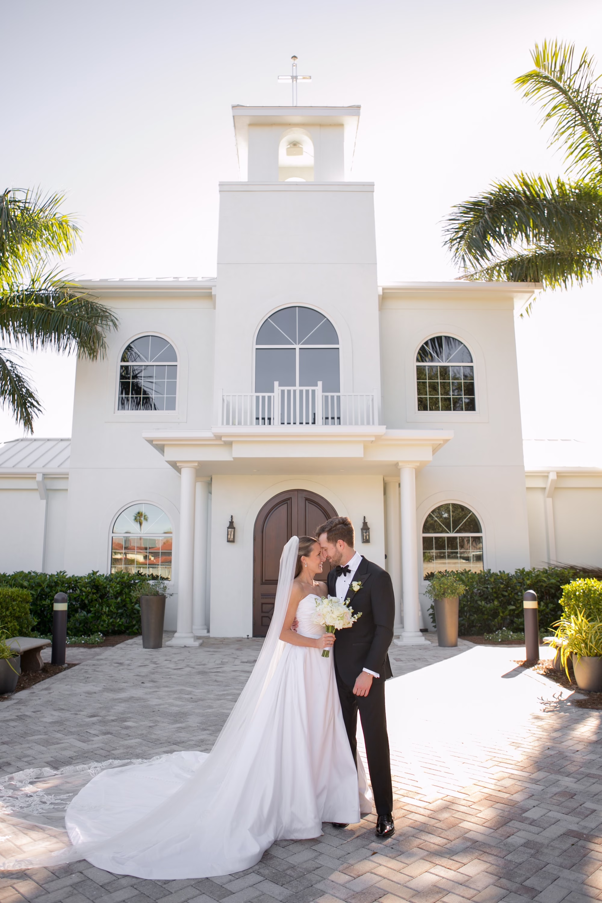 8Classic Black and White Wedding Ideas Tampa Bay Venue Harborside Chapel - Classic Black and White Clearwater Wedding | Harborside Chapel & The Fenway Bride and Groom Outdoor Florida Winter Wedding Portrait | Timeless Monochromatic White Roses Bridal Bouquet Inspiration | Elegant Cathedral Length Lace Detail Veil Ideas | Tampa Bay Photographer Carrie Wildes Photography Art and Design | Safety Harbor Event Venue Harborside Chapel