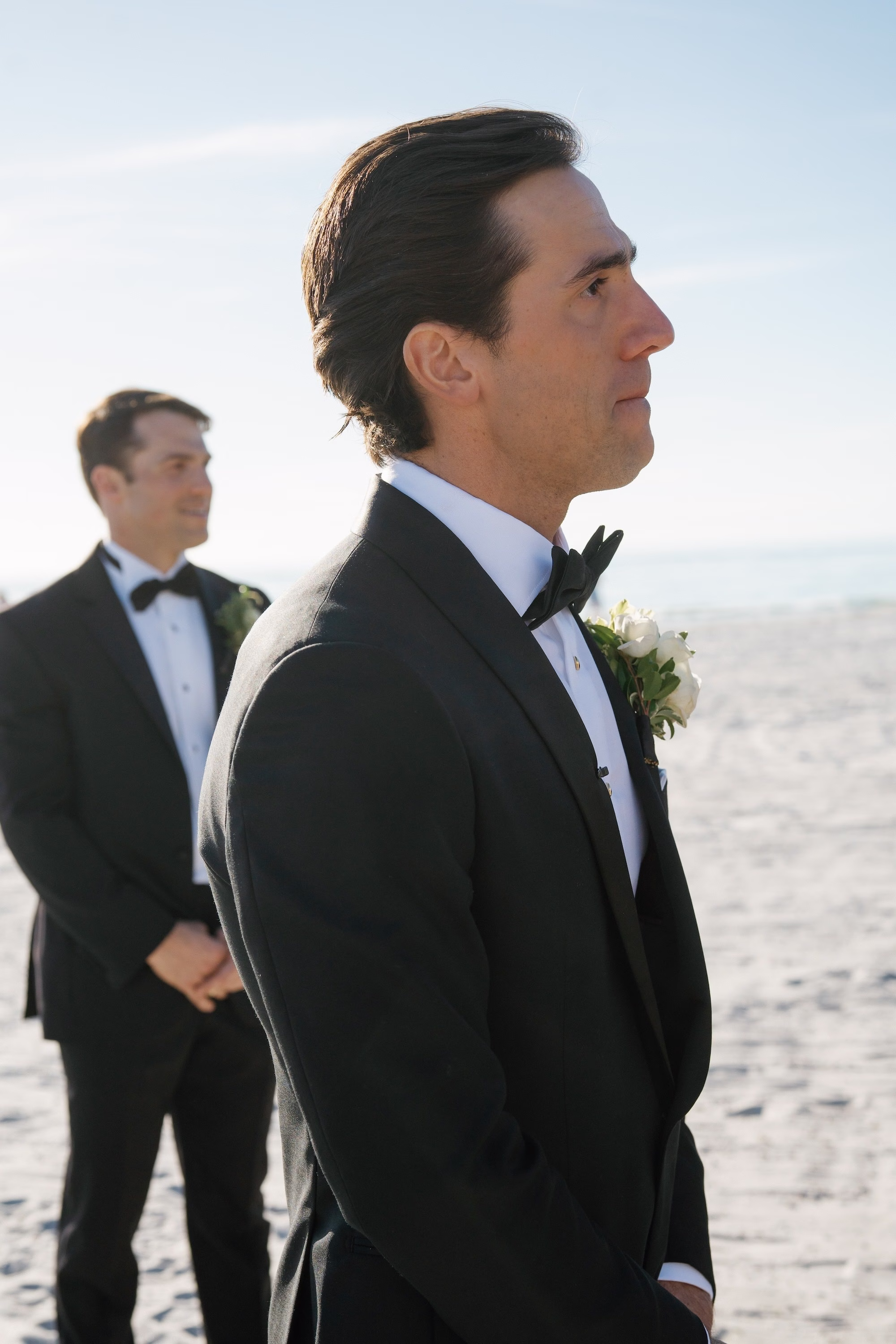 15Coastal Nancy Meyers Inspired Florida Beach Wedding - Coastal Blue, White, and Green Sarasota Wedding | The Resort at Longboat Key Club Groom's Reaction to Bride Walking Down Beach Wedding Ceremony Aisle