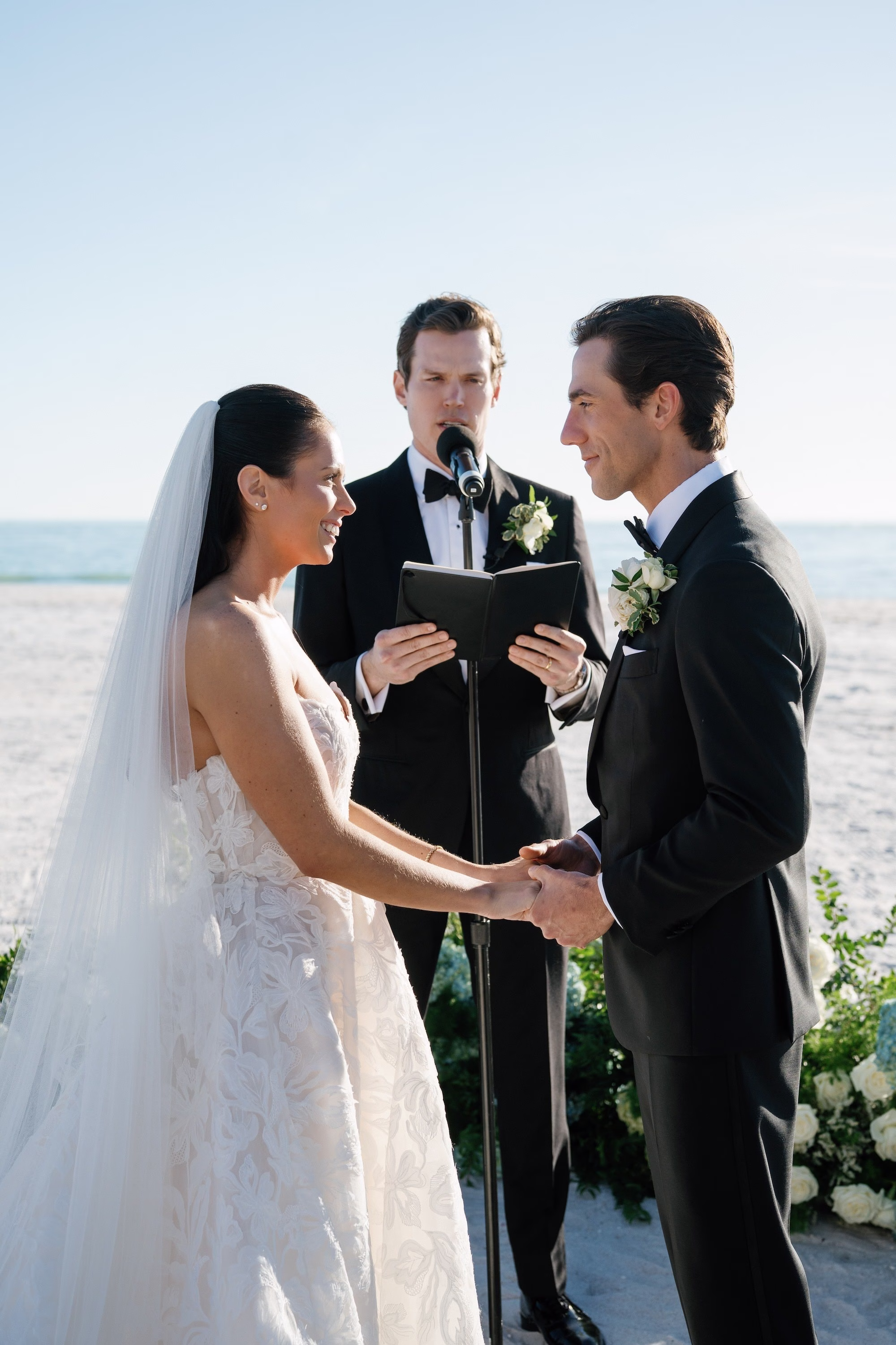 18Coastal Nancy Meyers Inspired Florida Beach Wedding - Coastal Blue, White, and Green Sarasota Wedding | The Resort at Longboat Key Club Bride and Groom Wedding Ceremony Vow Exchange Wedding Portrait on the Beach with Officiant