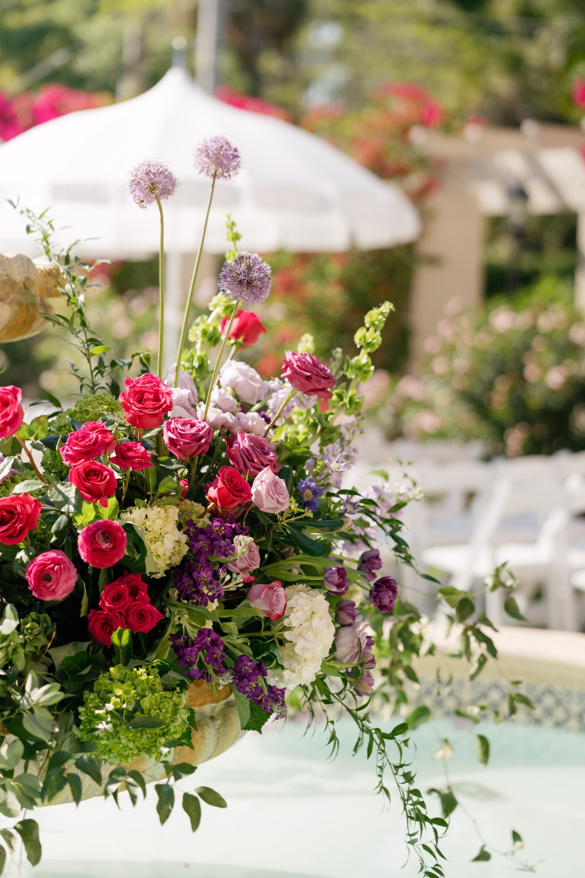 Whimsical Pink, Red and Purple Rose, Allium and Snapdragon Wedding Ceremony Floral Arrangement with White Umbrella Ideas | St. Pete Florist Bruce Wayne Florals