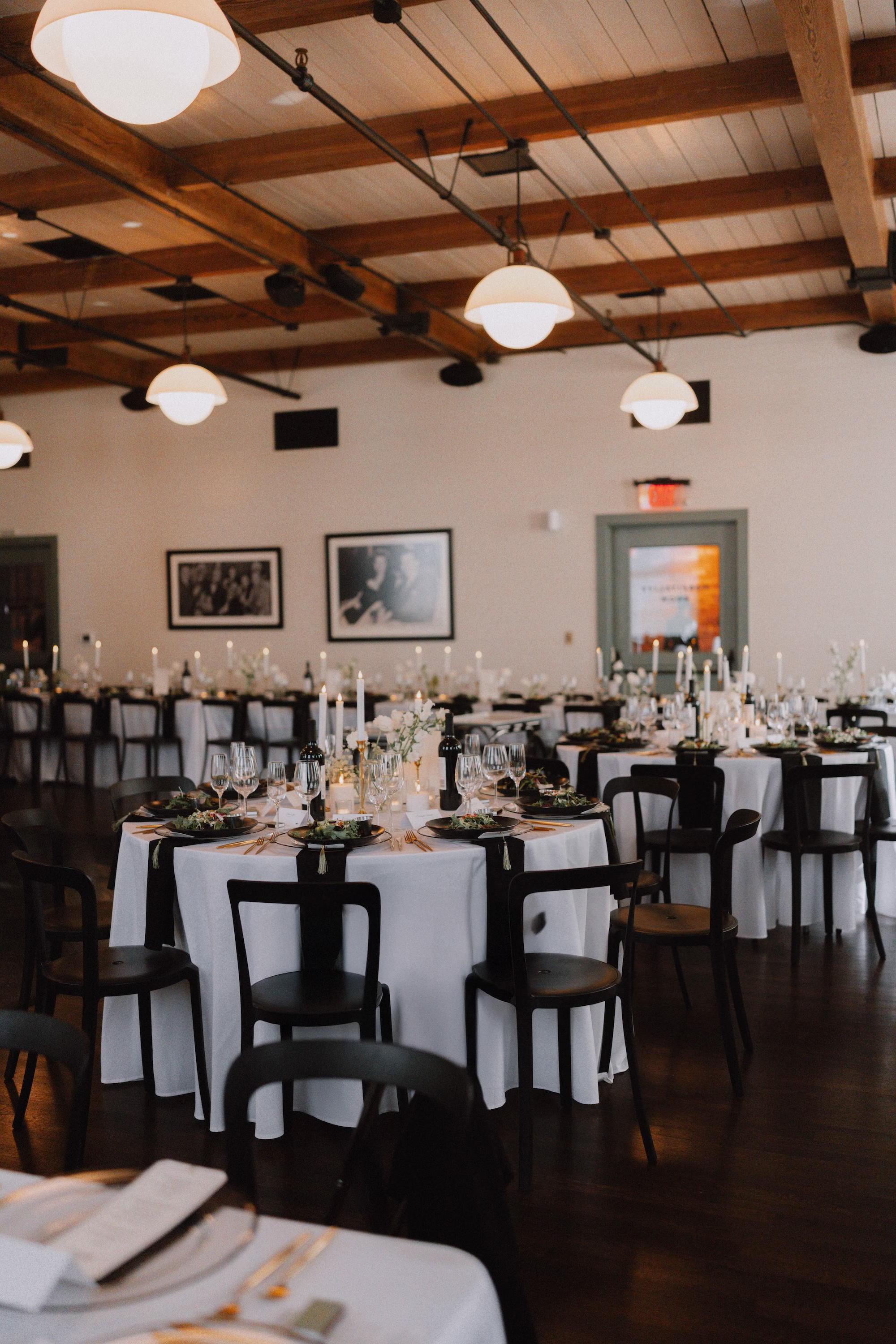 23Classic Modern Black and White Wedding Ideas Tampa Venue JC Newman Cigar Co - Modern Black and Ivory Ybor City Wedding | J.C. Newman Cigar Co. Modern Black and White Wedding Reception with White Linens, Black Bentwood Chairs, Taper Candles and Wood Beam Ceiling Reception Decor Ideas | Wedding Reception at Tampa Venue J.C. Newman Cigar Co.