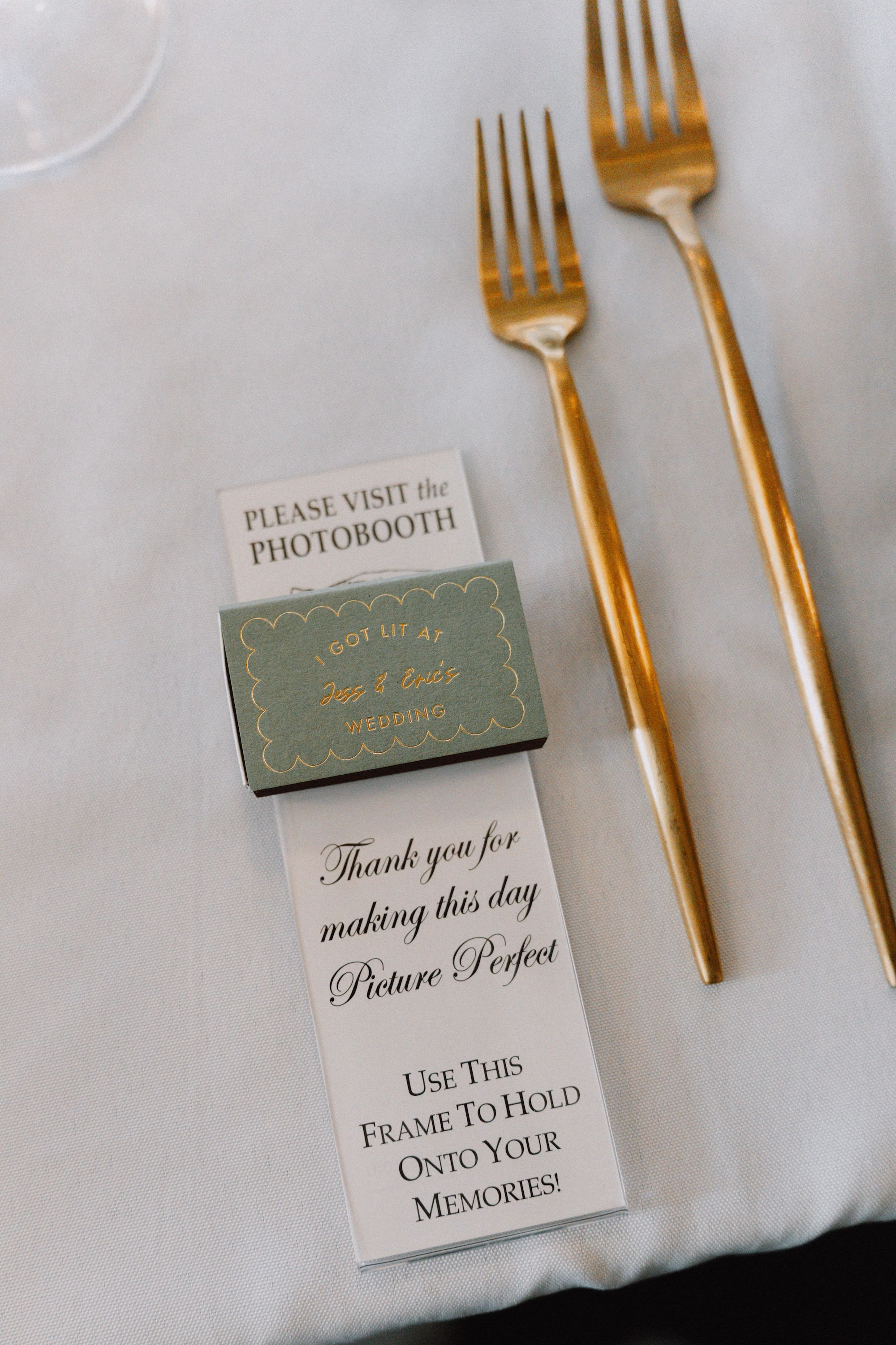 26Classic Modern Black and White Wedding Ideas - Modern Black and Ivory Ybor City Wedding | J.C. Newman Cigar Co. Custom Photo Booth Frame Wedding Favor with Sage Green Matchbook and Gold Flatware Reception Detail Ideas