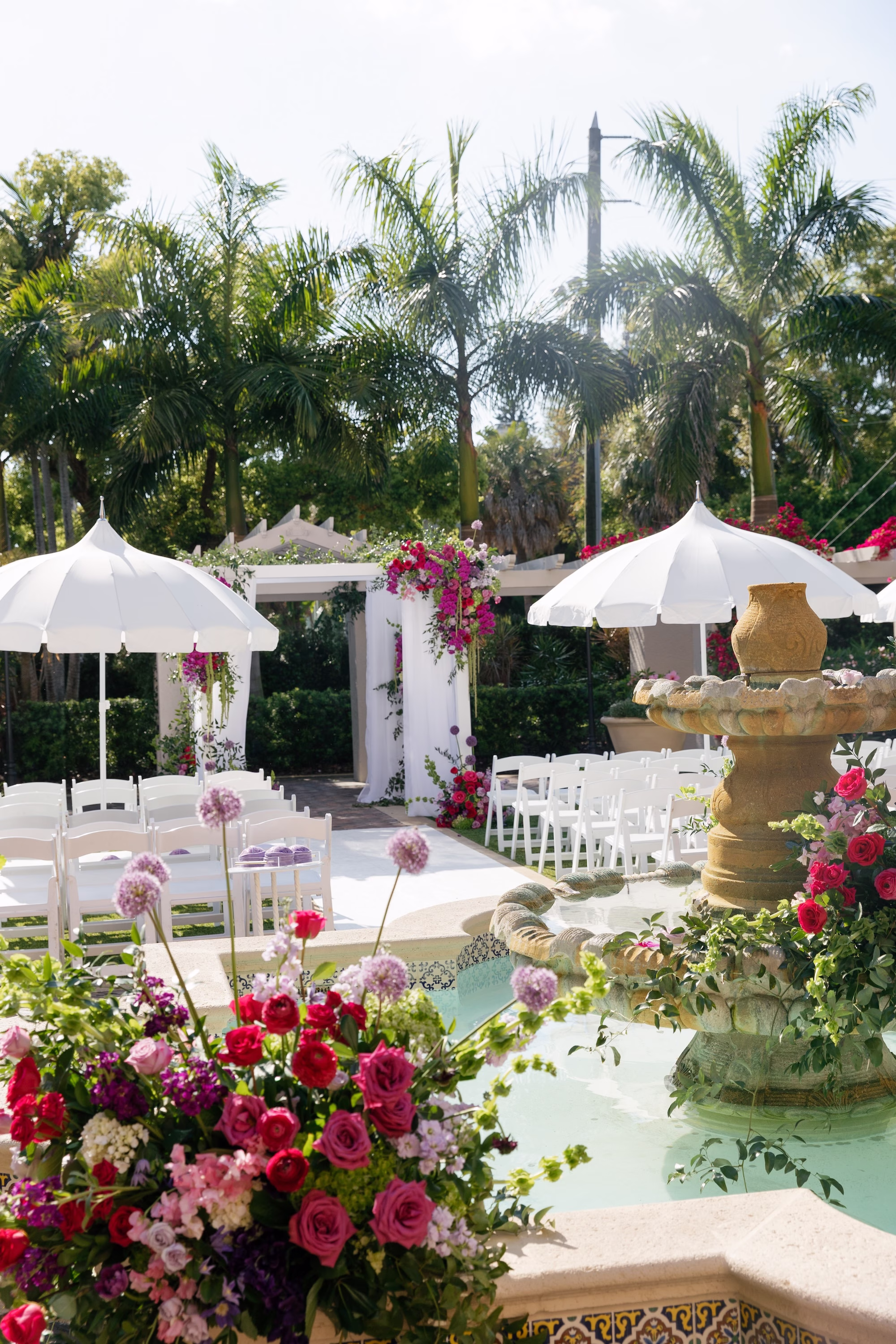 Whimsical Garden Wedding Ceremony Decor with Tiered Fountain Florals, White Umbrellas and Floral Chuppah Ideas | Tea Garden Wedding Ceremony at St. Pete Venue The Vinoy | Planner Parties A' La Carte | Florist Bruce Wayne Florals