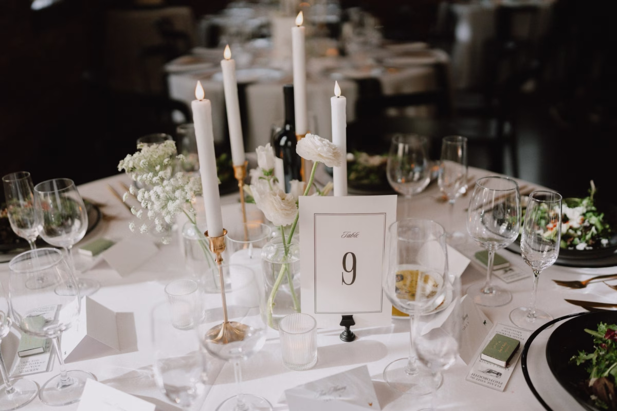 29Classic Modern Black and White Wedding Ideas - Modern Black and Ivory Ybor City Wedding | J.C. Newman Cigar Co. Modern White and Gold Wedding Reception Tablescape with Taper Candles, Bud Vases and Black and White Table Number Ideas