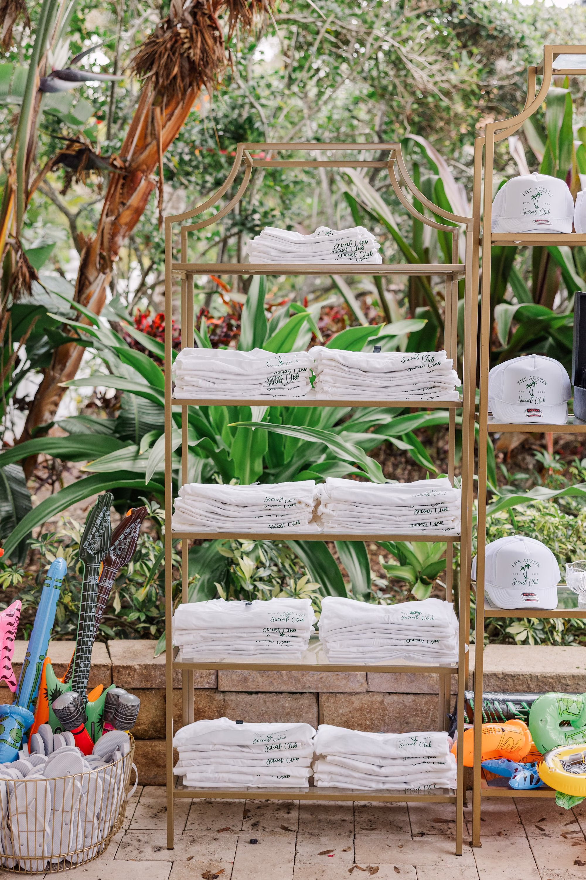 Custom White Trucker Hat Wedding Favors Displayed on Gold Shelf with Inflatable Pool Toys Ideas