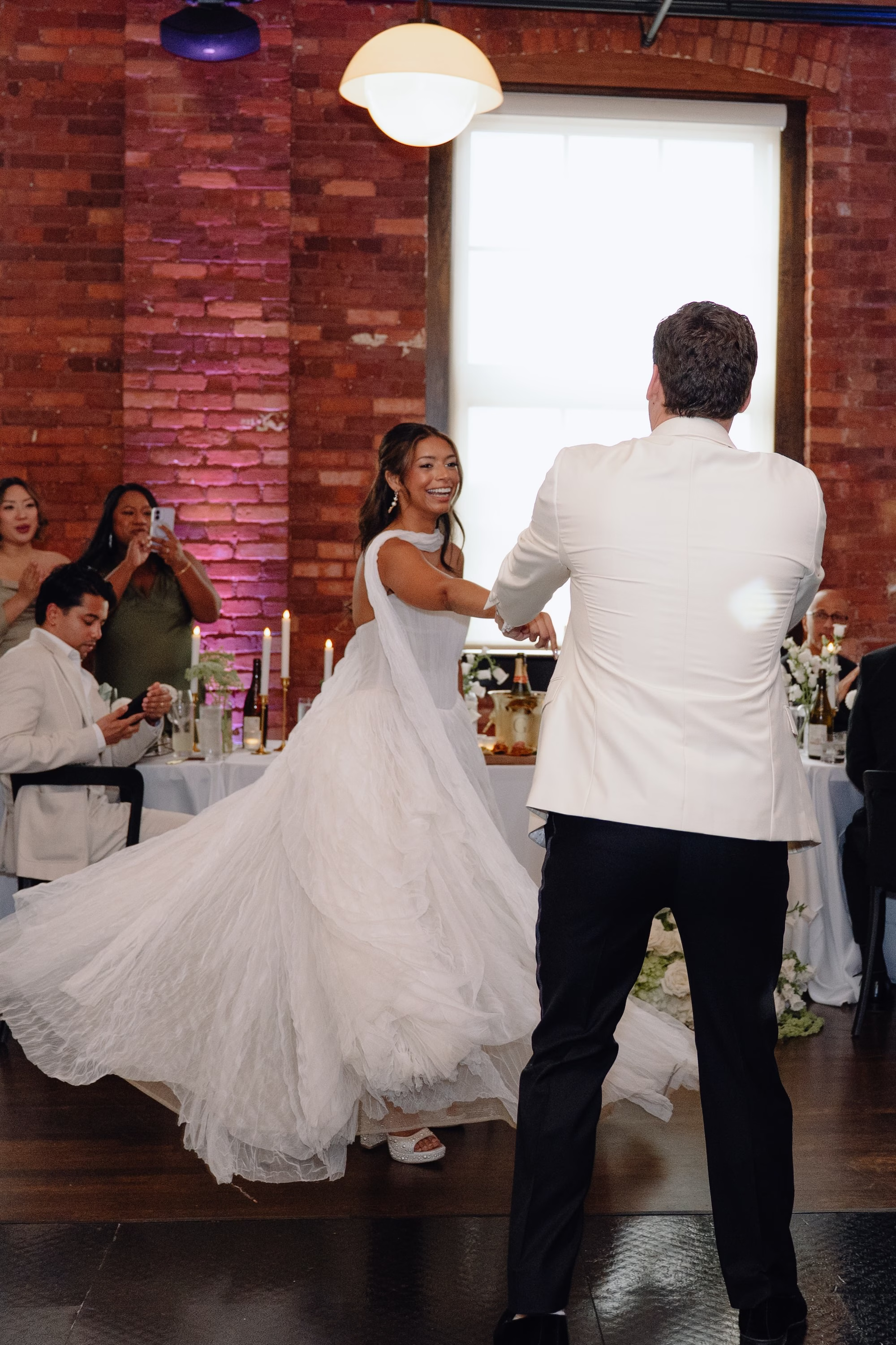37Classic Modern Black and White Wedding Ideas - Modern Black and Ivory Ybor City Wedding | J.C. Newman Cigar Co. Bride and Groom First Dance Wedding Portrait in White Dinner Jacket and Ivory Ballgown