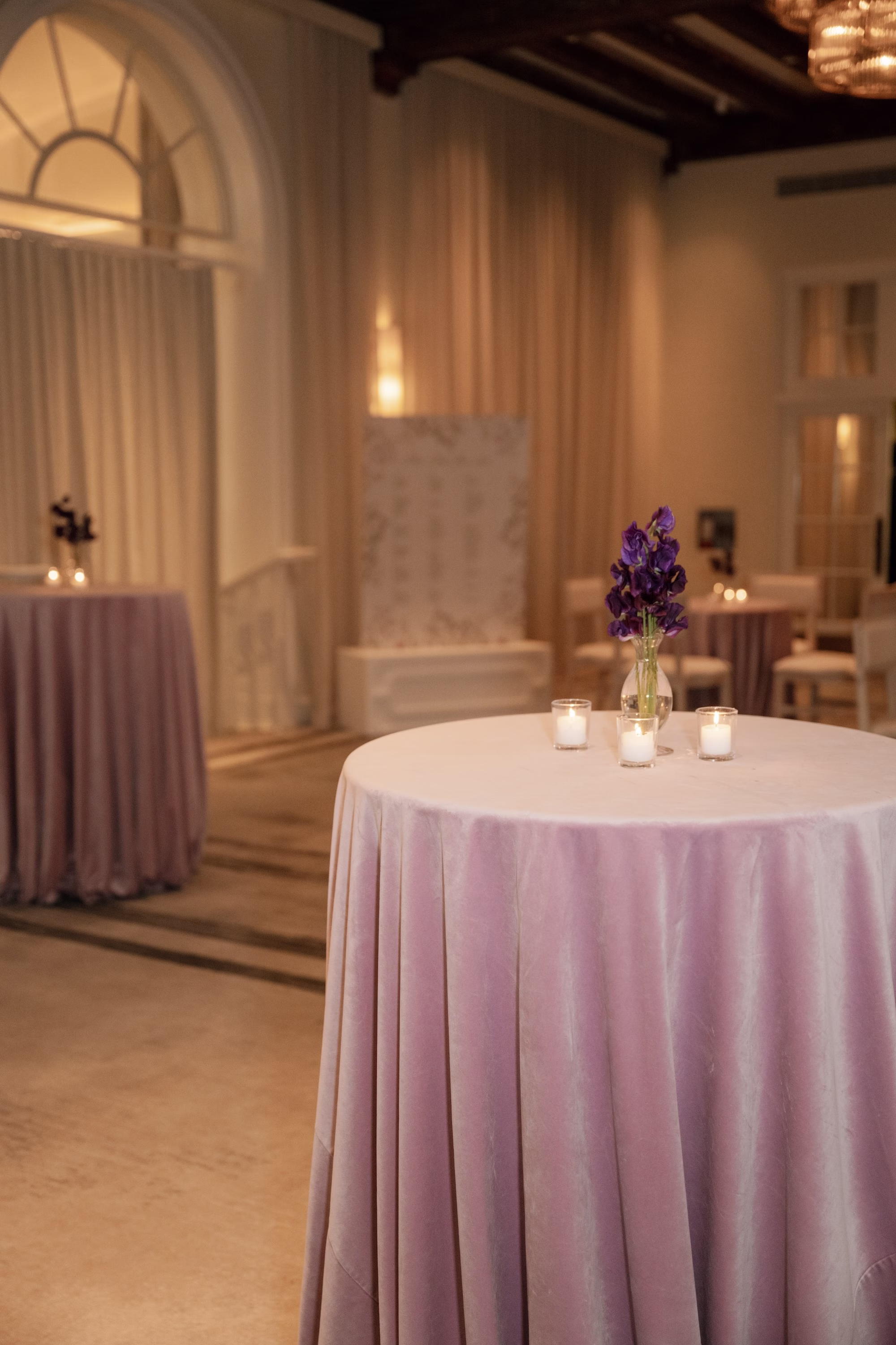 Lavender Velvet Linen Cocktail Table with Purple Orchid Bud Vase and Votive Candles Wedding Cocktail Hour Decor Ideas
