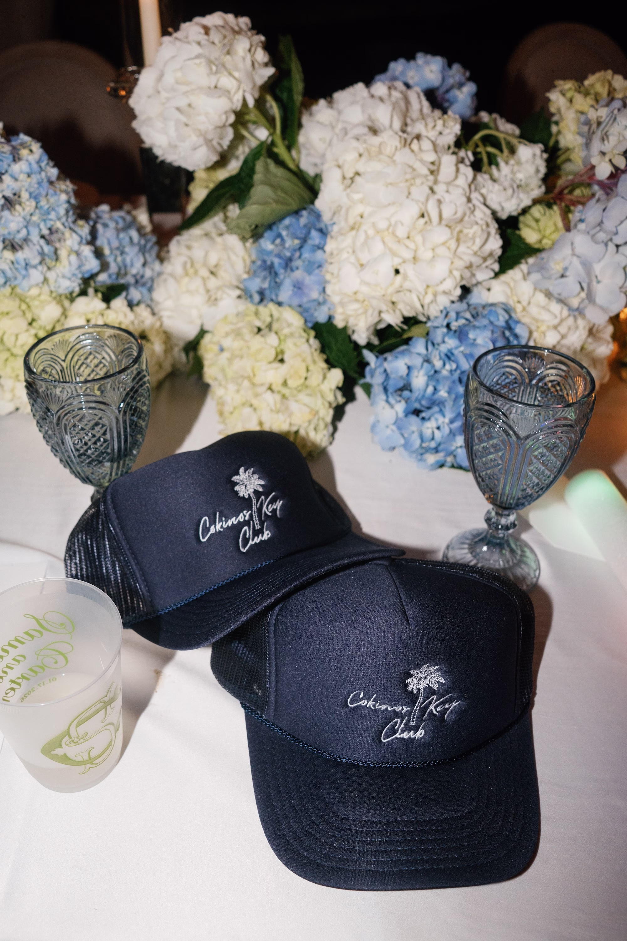 38Coastal Nancy Meyers Inspired Florida Beach Wedding - Coastal Blue, White, and Green Sarasota Wedding | The Resort at Longboat Key Club Custom Navy Cokinos Key Club Palm Tree Trucker Hat Wedding Favors with Blue and White Hydrangea Ideas