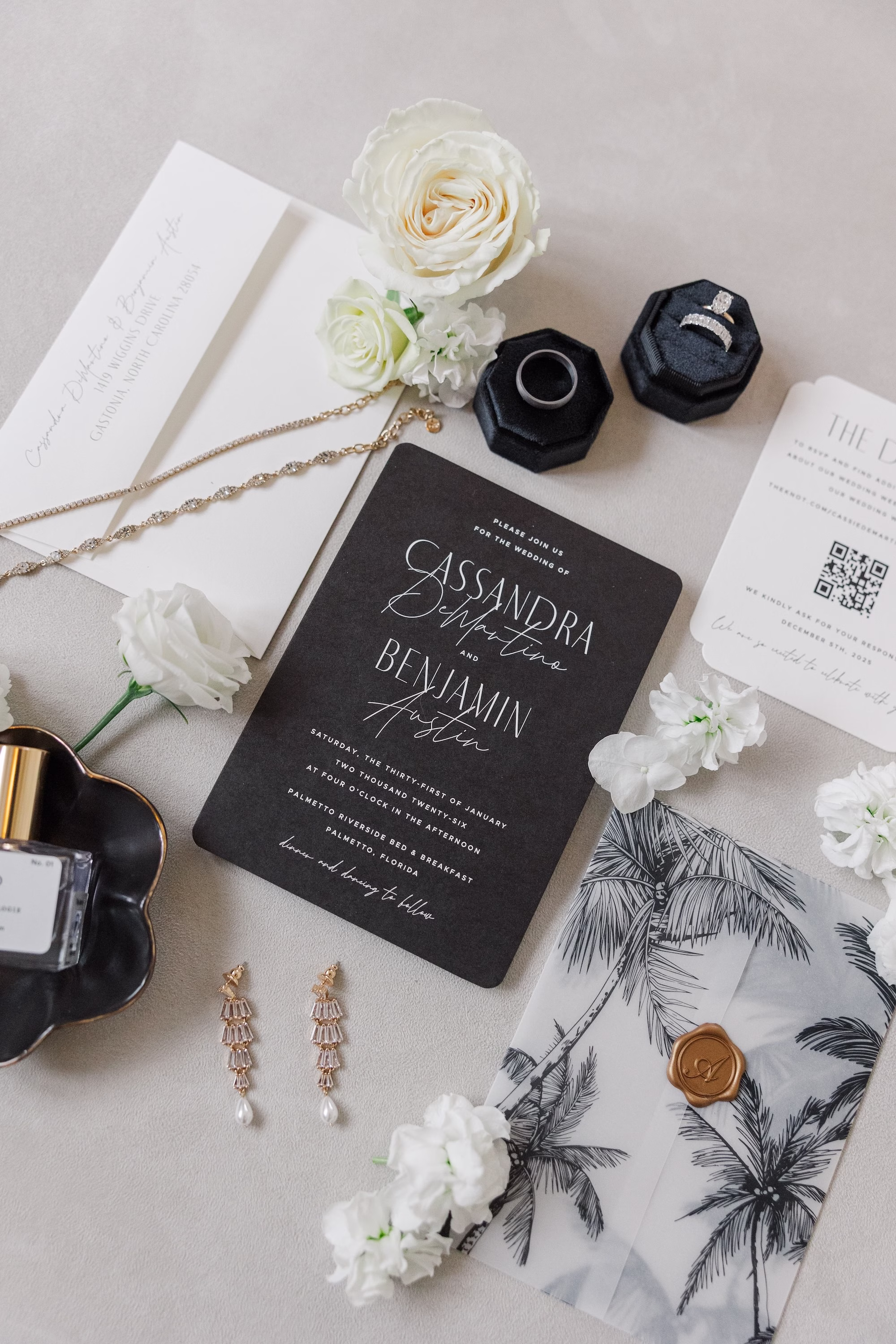 Black and White Wedding Invitation Suite with Palm Print Vellum, Gold Wax Seal and Black Ring Box Flat Lay Inspiration
