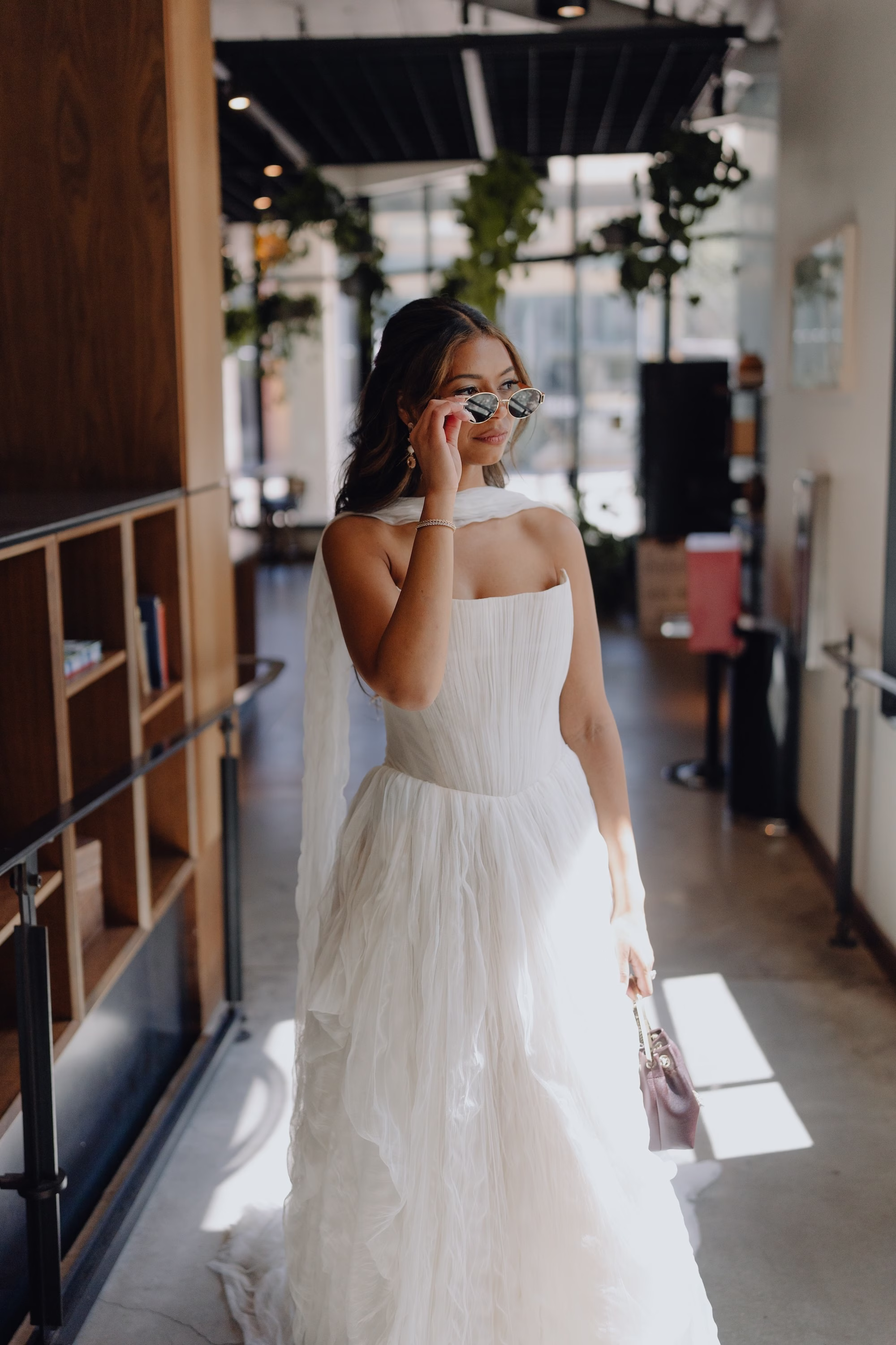 3Classic Modern Black and White Wedding Ideas - Modern Black and Ivory Ybor City Wedding | J.C. Newman Cigar Co. Modern Ivory Strapless Watters Wedding Dress with Tulle Skirt Inspiration and Neck Scarf Bridal Portrait with Sunglasses