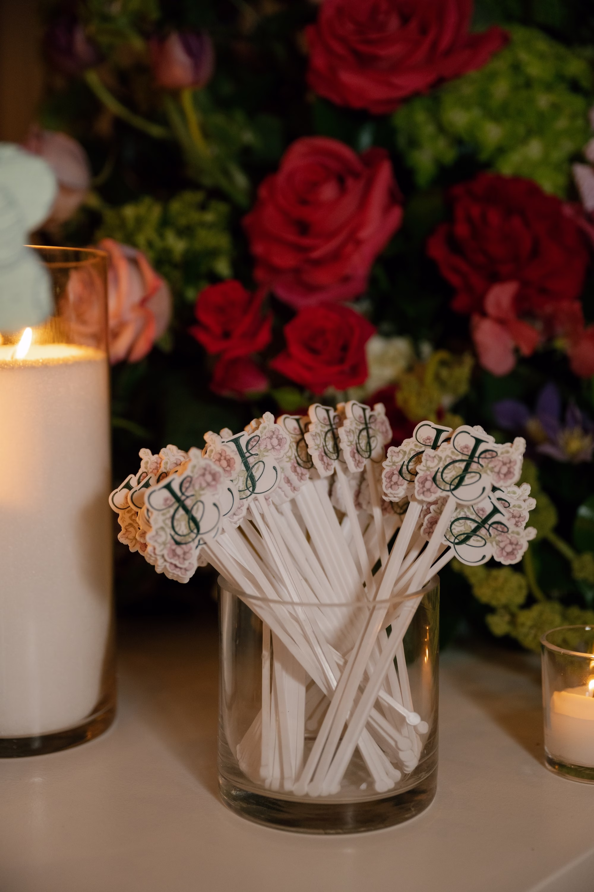 Custom Floral Monogram Drink Stirrers with Red Rose Bar Arrangement Wedding Cocktail Hour Ideas