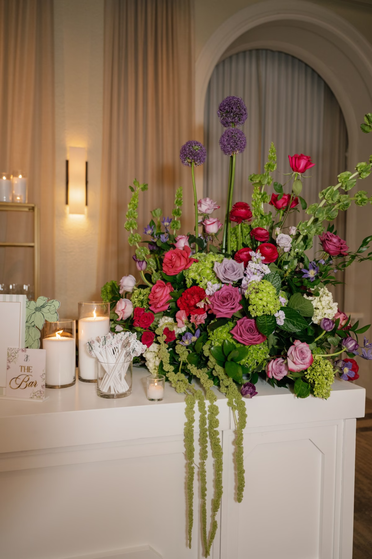 Whimsical Pink, Red, Purple and Green Rose, Allium and Hanging Amaranthus Wedding Bar Floral Arrangement Ideas | St. Pete Florist Bruce Wayne Florals