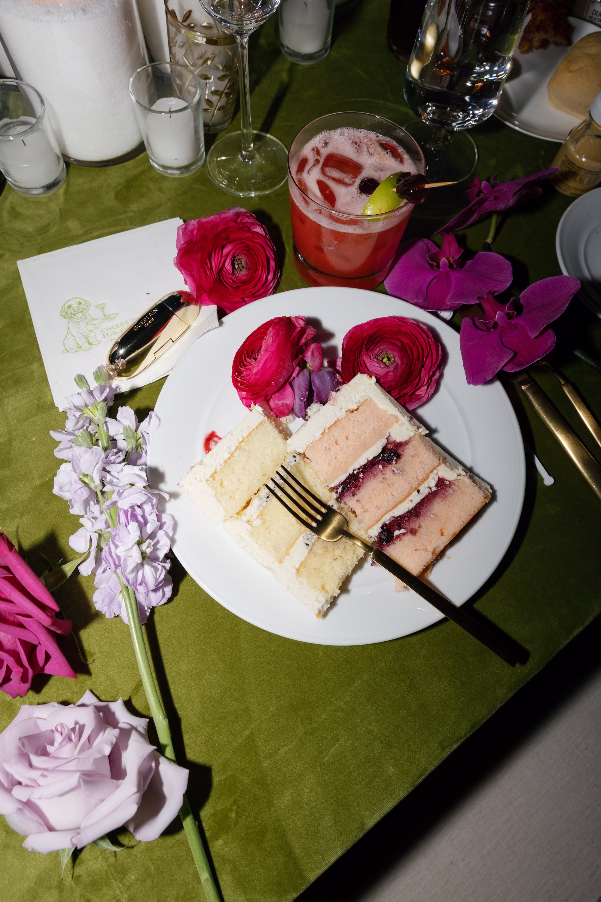 Pink and White Layered Wedding Cake Slice with Fuchsia Ranunculus and Orchids on Green Velvet Linen Ideas