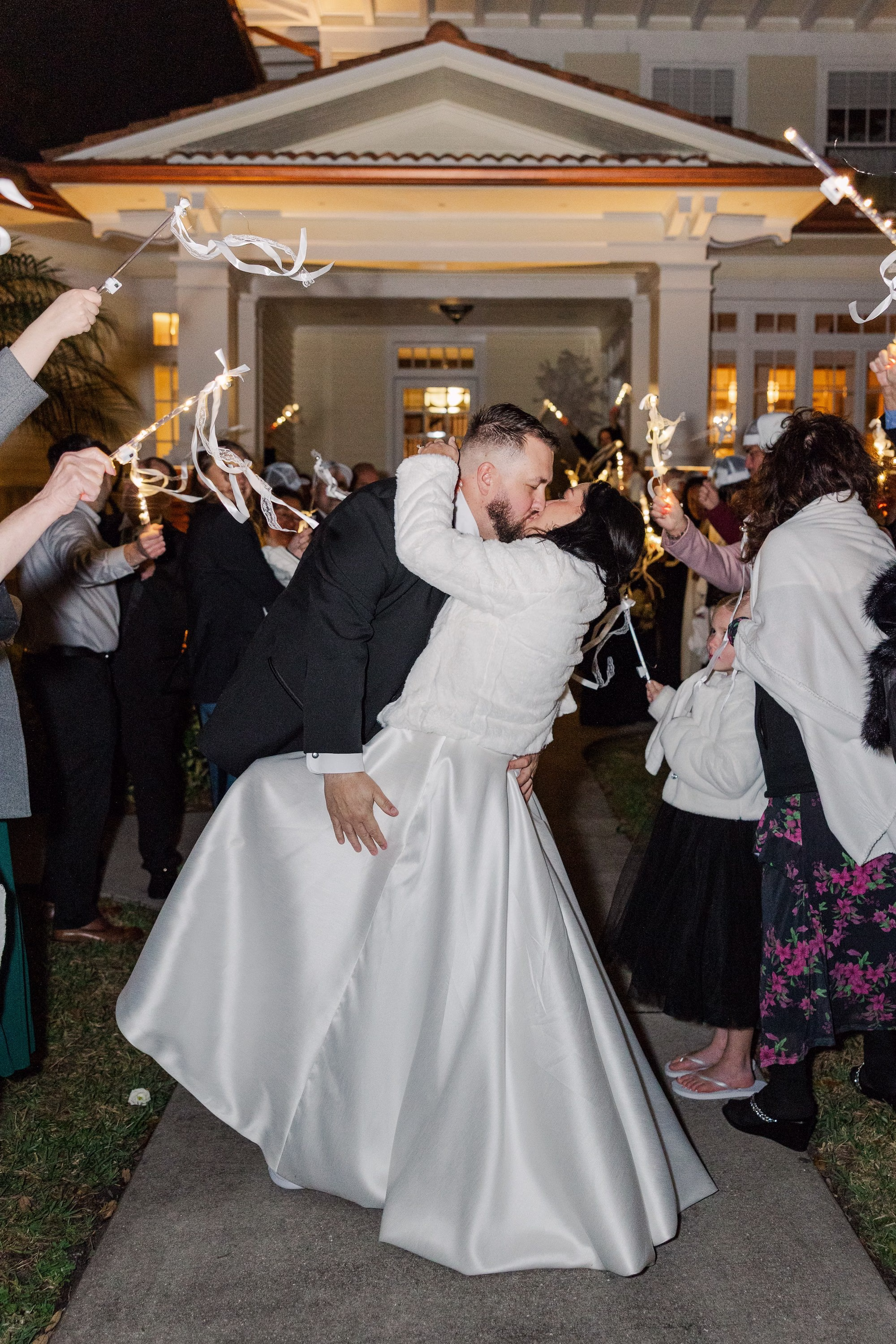 Bride and Groom Wedding Exit with Light Up Ribbon Wands in Front of Old Florida Home