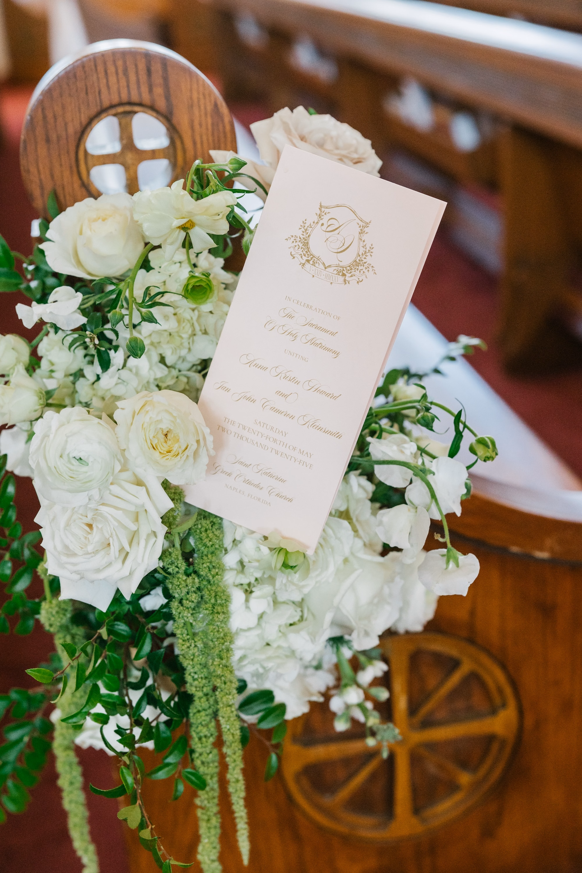11Luxurious Romantic Garden Ballroom Wedding Inspiration - Luxurious Garden-Inspired Naples Wedding | Hyatt Regency Coconut Point Wedding Ceremony Program and Pew Floral Detail | White Rose, Ranunculus and Trailing Greenery Aisle Decor Inspiration | Church Pew Flower Arrangement Ideas
