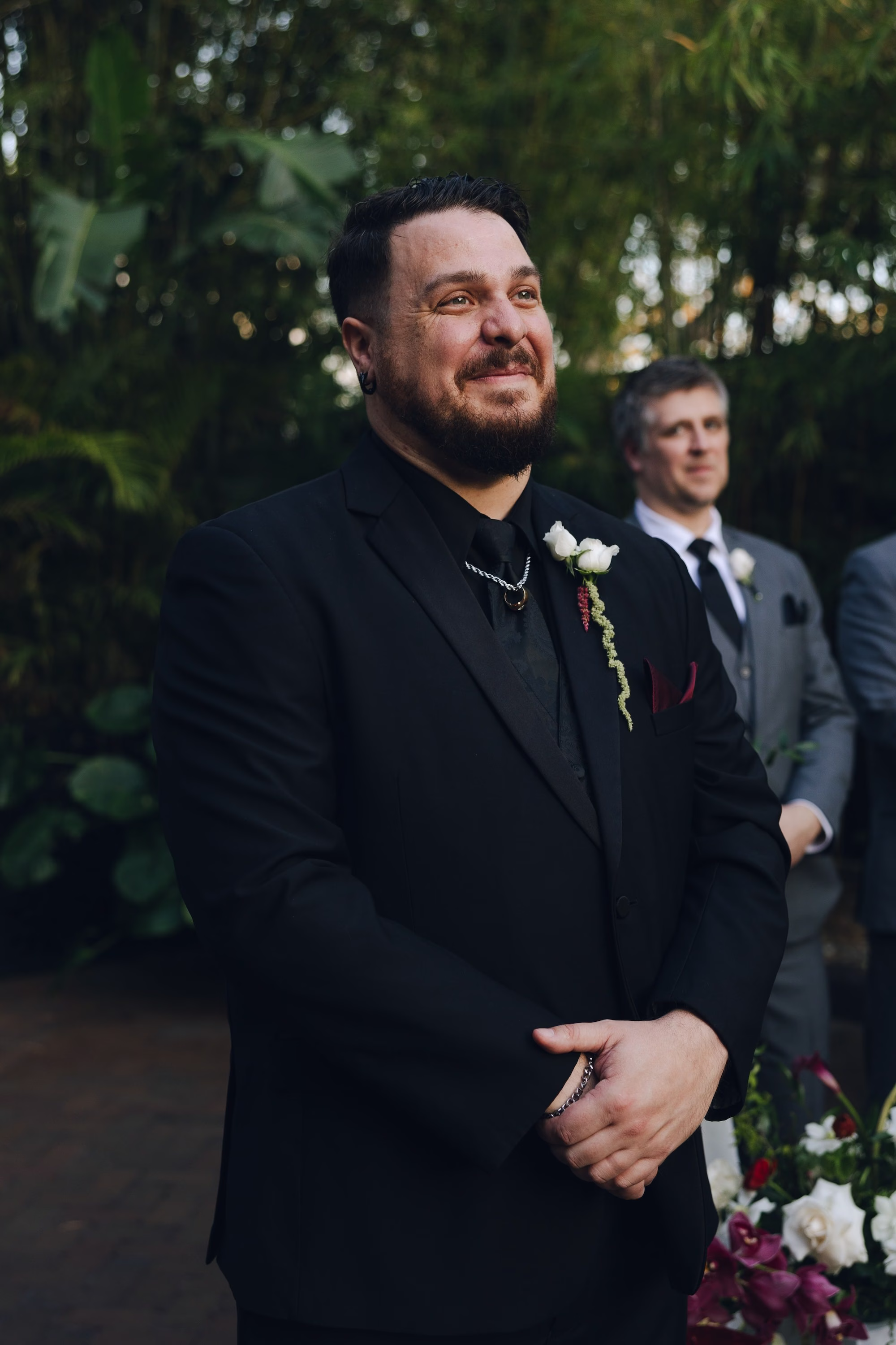 13Burgundy Vintage Romance Wedding Ideas - Vintage Romance Pink and Burgundy Downtown St. Pete Wedding | NOVA 535 Groom in All-Black Suit with Burgundy Anthurium Boutonniere Tearing Up Seeing Bride Walk Down the Aisle