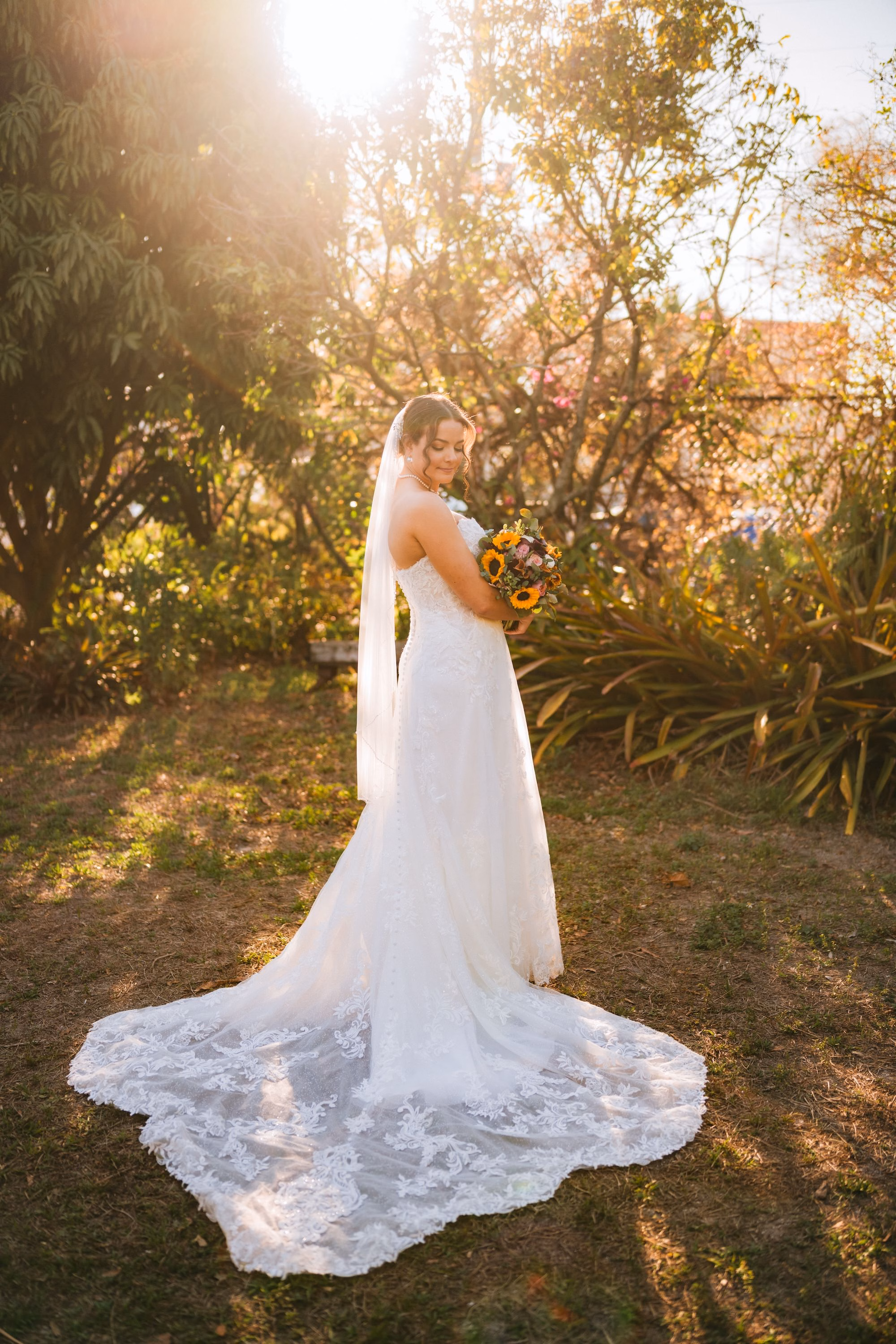 15St Pete Museum Outdoor Garden Ceremony Venue Duncan McClellan Gallery - Neon Disco Meets Old Florida St. Pete Wedding | FloridaRAMA Bride Wedding Portrait | Strapless Lace Wedding Dress with Short Veil and Lace Floral Train Inspiration | Sunflower Bridal Bouquet Ideas