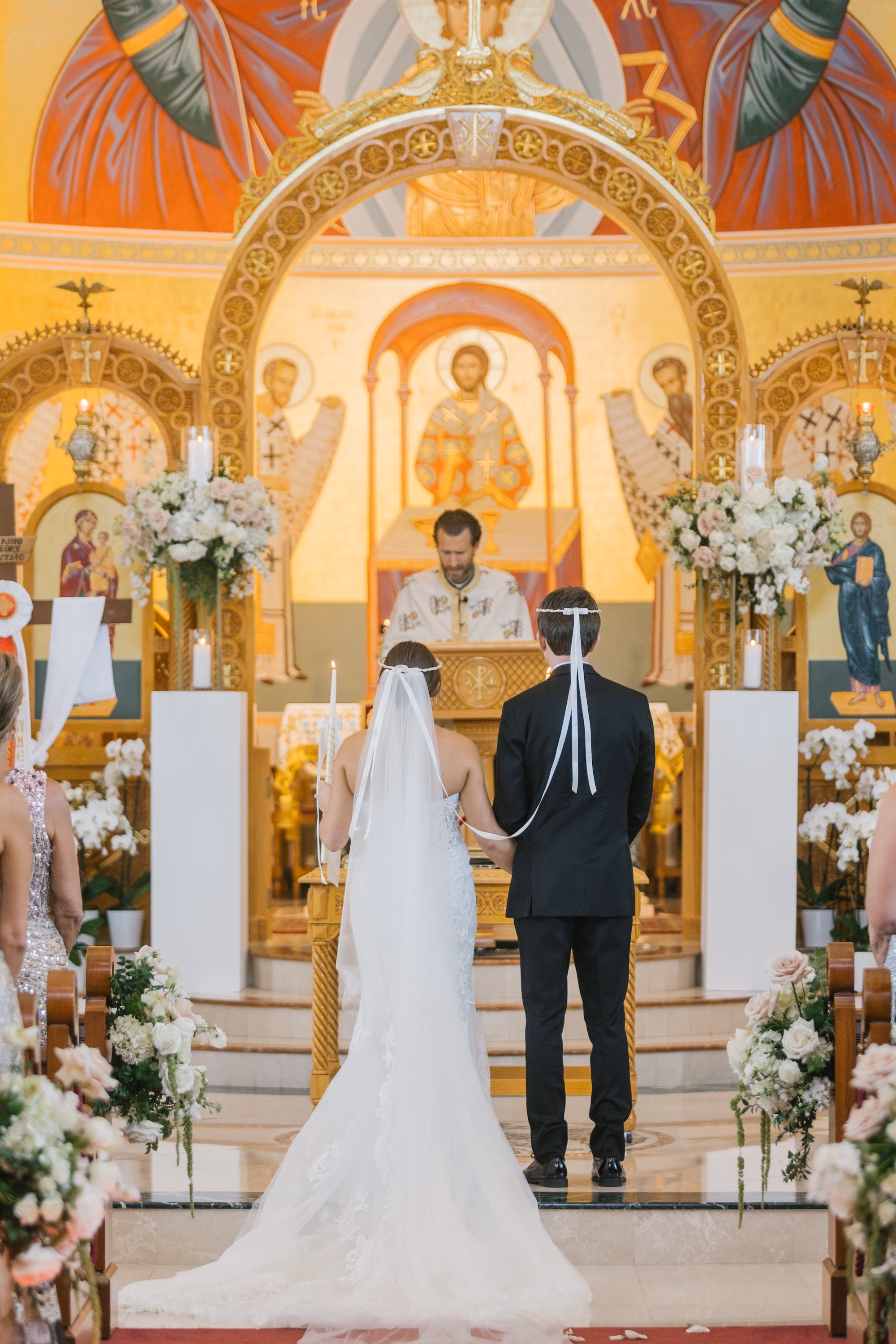 16Luxurious Romantic Garden Ballroom Wedding Inspiration - Luxurious Garden-Inspired Naples Wedding | Hyatt Regency Coconut Point Bride and Groom Exchanging Vows Wedding Ceremony Portrait | Cathedral Length Veil and Lace Mermaid Gown Inspiration | Traditional Greek Orthodox Wedding Crowning Ceremony Ideas | Bonita Springs Venue St. Katherine Greek Orthodox Church