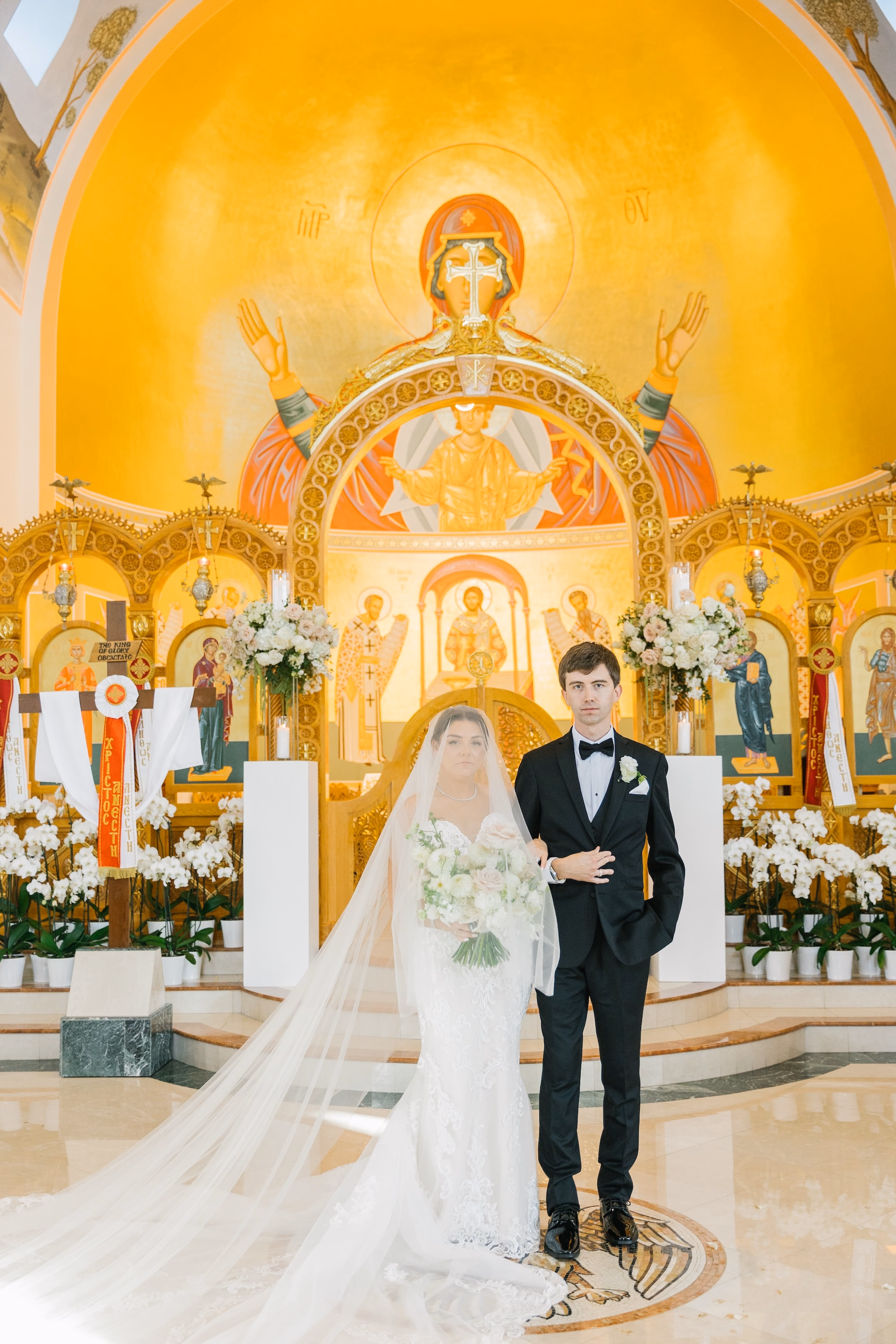 17Luxurious Romantic Garden Ballroom Wedding Inspiration Naples VenueSt. Katherines Greek - Luxurious Garden-Inspired Naples Wedding | Hyatt Regency Coconut Point Bride and Groom Wedding Ceremony Portrait at the Altar | Gold Mosaic Iconography Church Backdrop Inspiration | Greek Orthodox Wedding Ceremony Tradition Ideas | Bonita Springs Venue St. Katherine Greek Orthodox Church