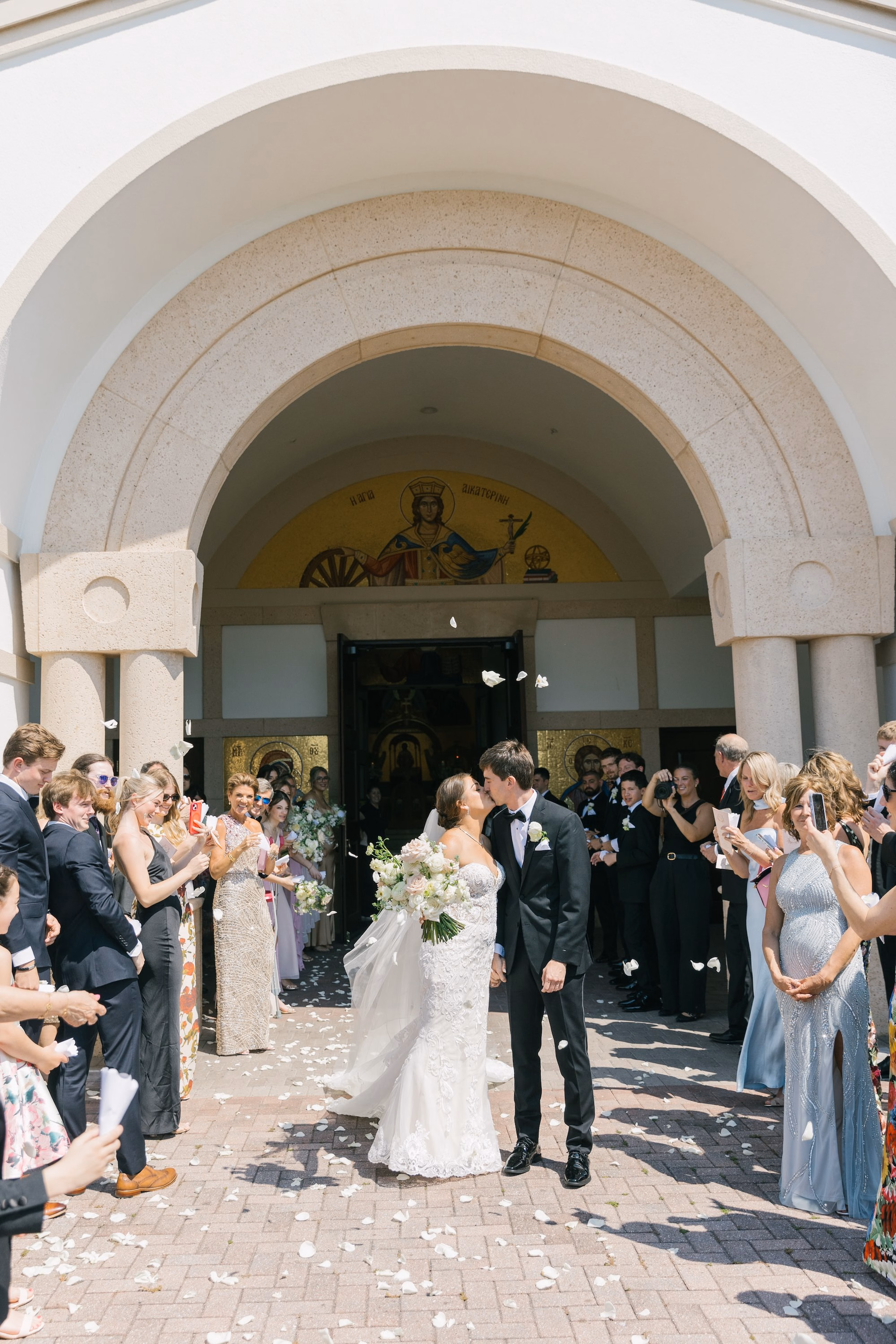 18Luxurious Romantic Garden Ballroom Wedding Inspiration - Luxurious Garden-Inspired Naples Wedding | Hyatt Regency Coconut Point Bride and Groom Wedding Ceremony Exit Portrait | Petal Toss Church Exit Inspiration | Arched Stone Doorway Just Married Send Off Ideas | Bonita Springs Venue St. Katherine Greek Orthodox Church