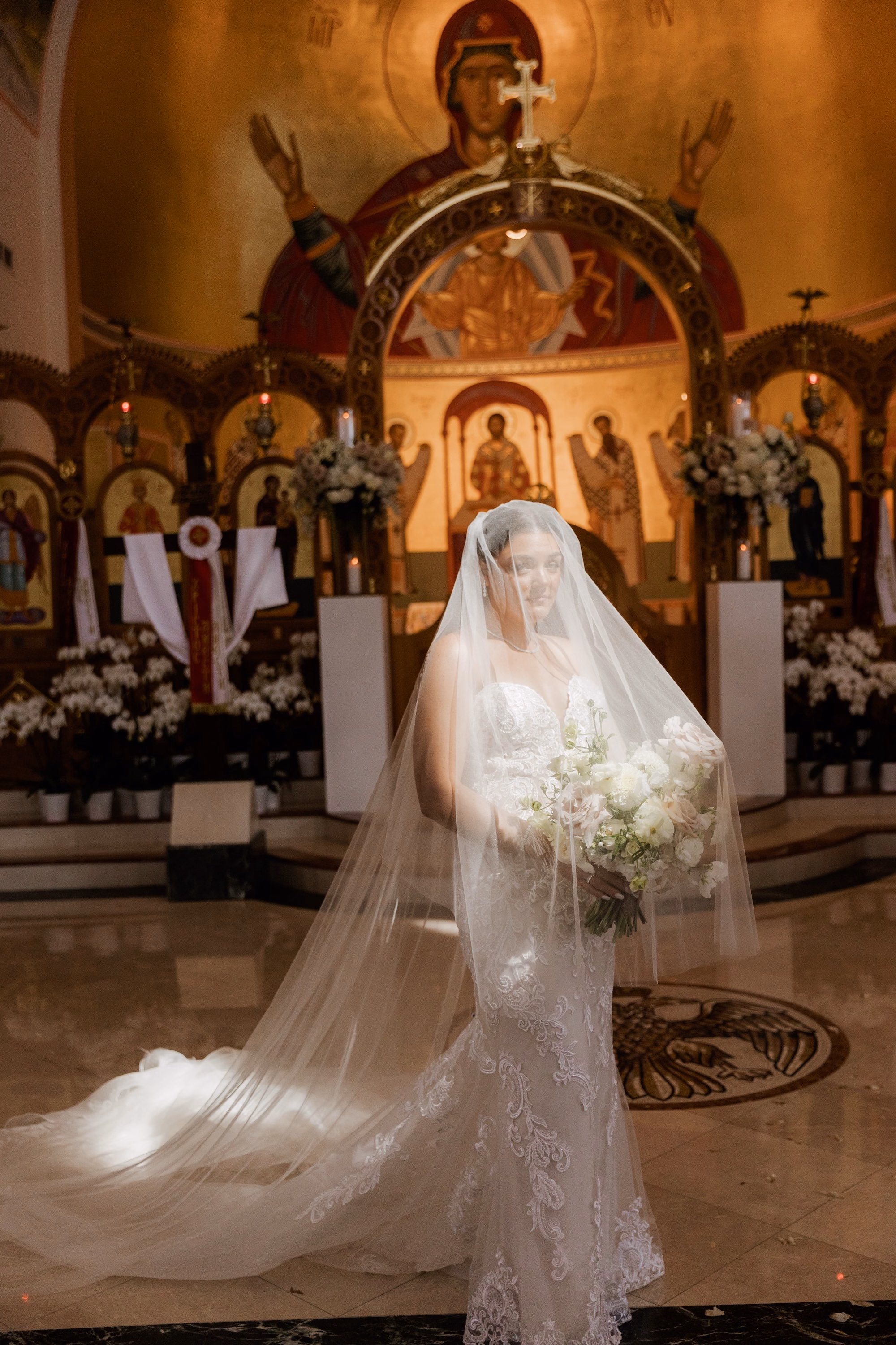 19Luxurious Romantic Garden Ballroom Wedding Inspiration Naples VenueSt. Katherines Greek - Luxurious Garden-Inspired Naples Wedding | Hyatt Regency Coconut Point Bride Full Length Wedding Portrait in Church | Lace Mermaid Wedding Gown with Cathedral Length Veil Inspiration | White and Blush Bridal Bouquet Ideas | Bonita Springs Venue St. Katherine Greek Orthodox Church