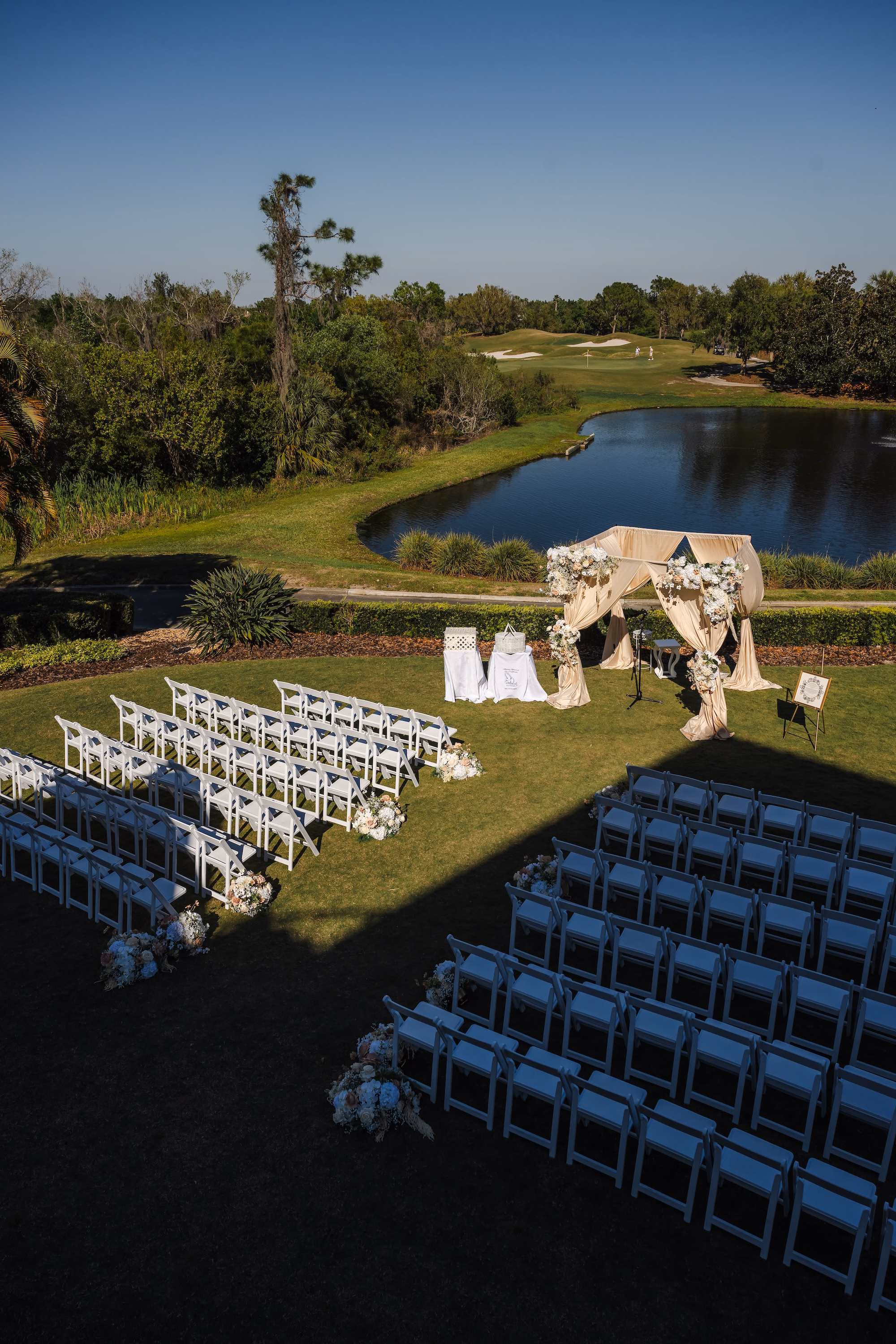 20Romantic Gold and Ivory Florida Wedding Ideas Sarasota Venue Lakewood Ranch Golf Country Club - Romantic Ivory and Gold Sarasota Wedding | Lakewood Ranch Golf & Country Club Outdoor Lawn Ceremony with Curved Semi Circle Seating Arrangement Lakewood Ranch Golf and Country Club Traditional Jewish Wedding Ceremony | Draped Chuppah and White Folding Chairs Jewish Wedding Ideas | St. Pete Photographer and Videographer Iyrus Weddings
