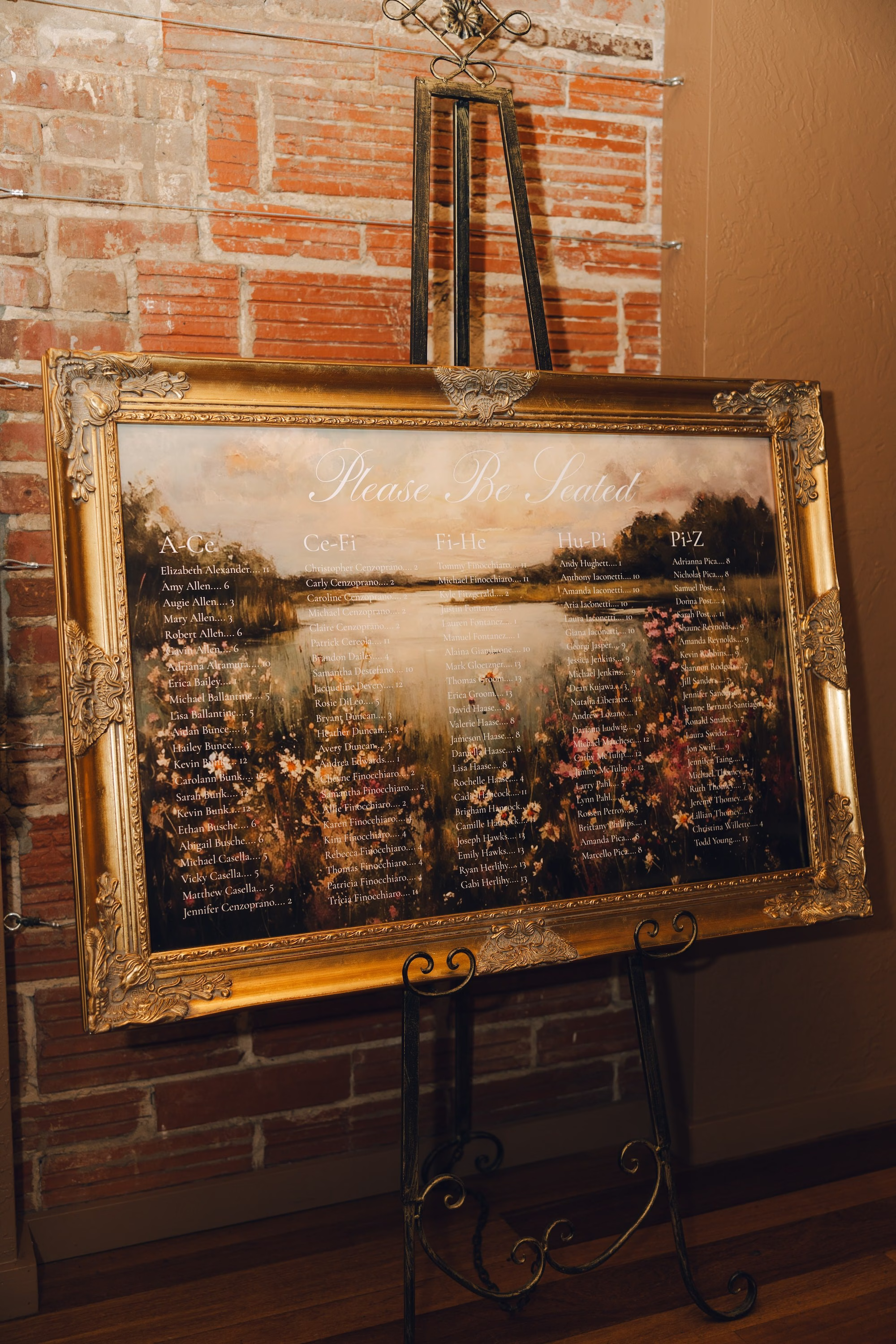 21Burgundy Vintage Romance Wedding Ideas - Vintage Romance Pink and Burgundy Downtown St. Pete Wedding | NOVA 535 Vintage Gold Framed Landscape Painting Seating Chart on Easel Against Exposed Brick Wall Ideas