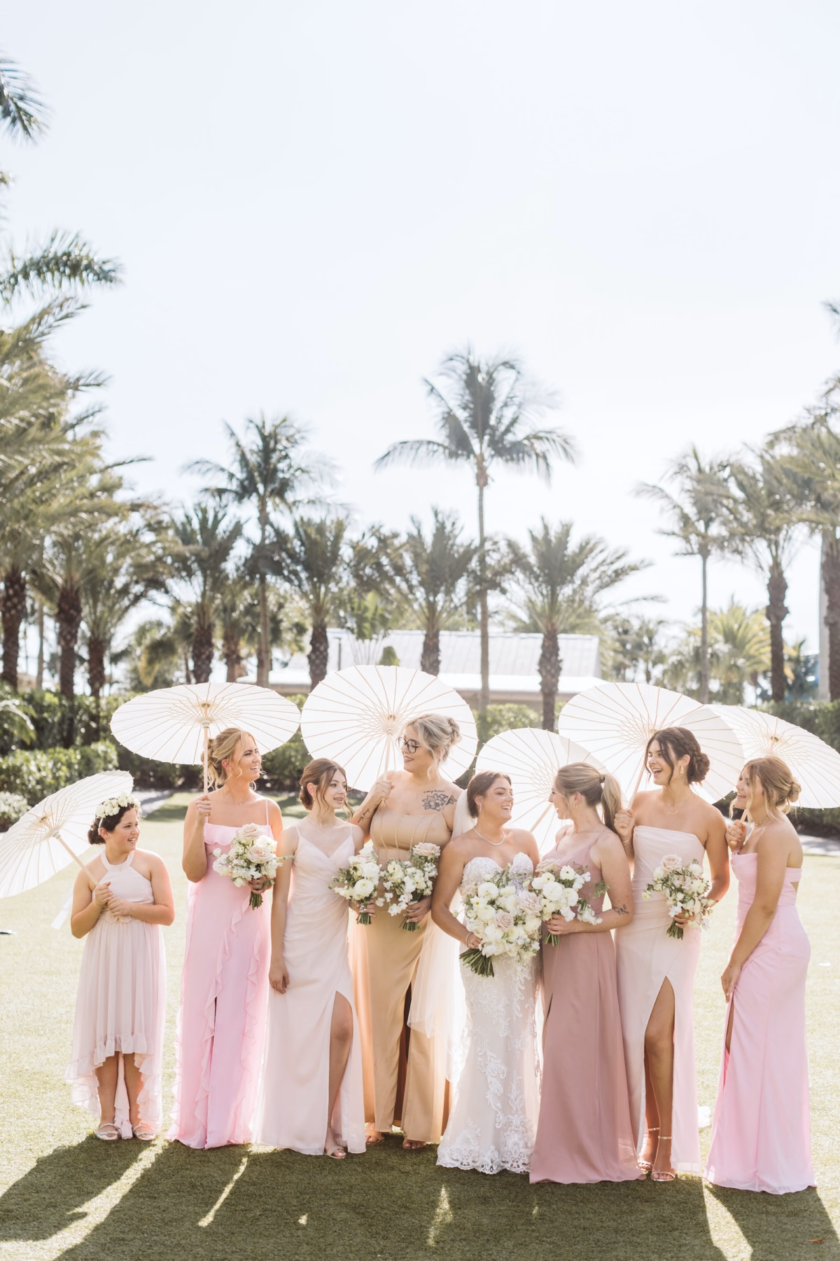 22Luxurious Romantic Garden Ballroom Wedding Inspiration - Luxurious Garden-Inspired Naples Wedding | Hyatt Regency Coconut Point Bridesmaids Wedding Portrait with Ivory Parasols | Mismatched Blush, Pink and Champagne Bridesmaid Dresses Inspiration | White and Blush Bridesmaid Bouquet Ideas